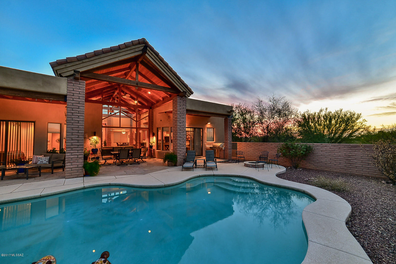 Custom home with amazing architecture! Awe inspiring exposed beam cathedral ceilings lead to a wall of windows that showcase the sparkling pool and breathtaking mountain views! The gourmet kitchen has beautiful granite, SS appliances and opens up for a lovely living room with cozy beehive fireplace. There are too many features and upgrades to list - granite, travertine, jacuzzi tub in master bath, flagstone patio, built-in BBQ, central vac, and so much more! All situated on a spacious 1.14 acre lot in tranquil Coyote Creek. This gated community amenities include a rec center, basketball, tennis, volleyball and pickleball courts. An incredible home in a marvelous location!