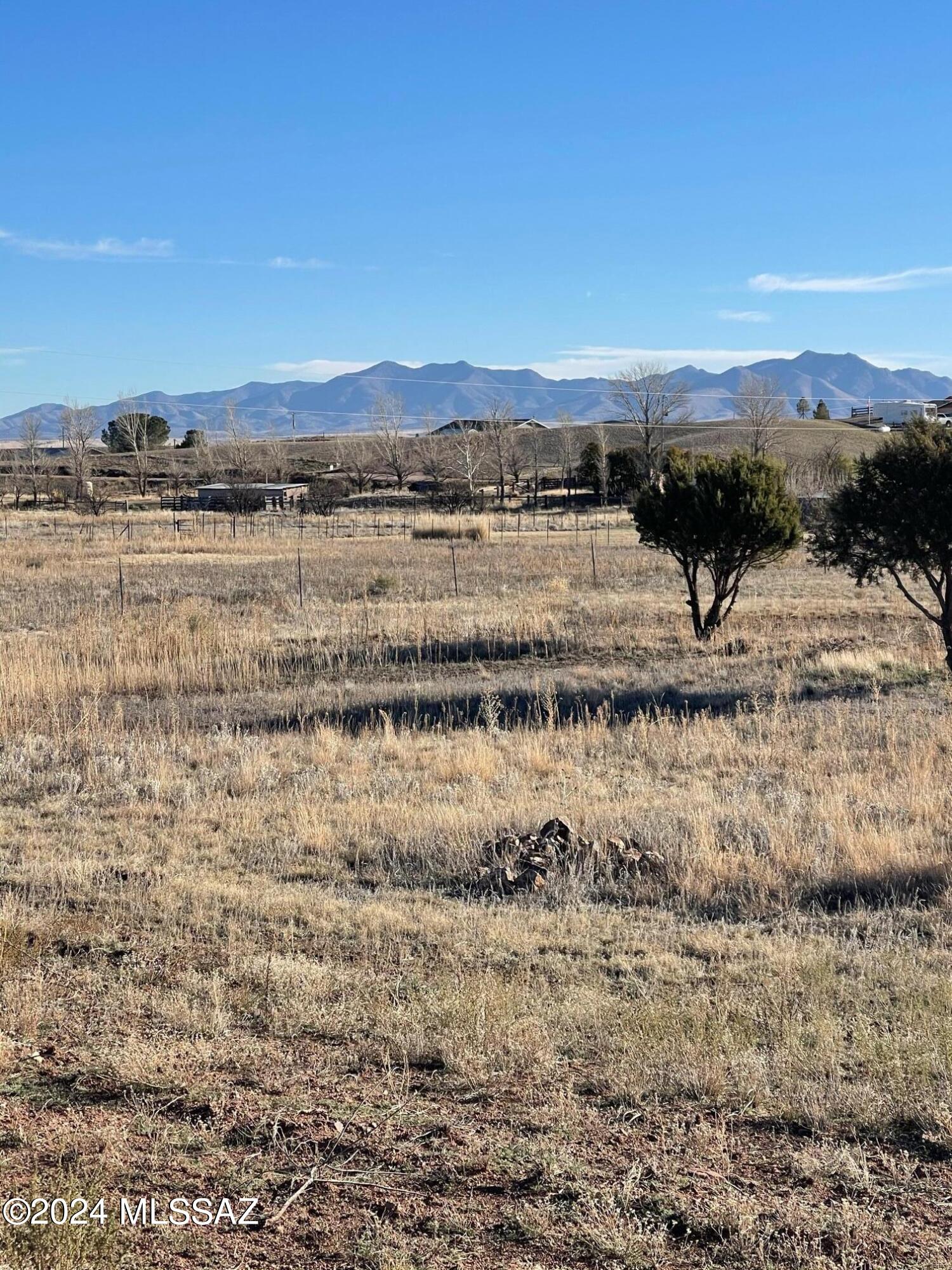A buildable lot close to the Sonoita / Elgin  wine country and the cross roads of Sonoita. The area is disiganted as a flood area. The lot has pad build up To allow for future home site. Pad may need to be expanded or altered.  Good Views. Fence posts in place to add fencing. Perc Test has been completed.