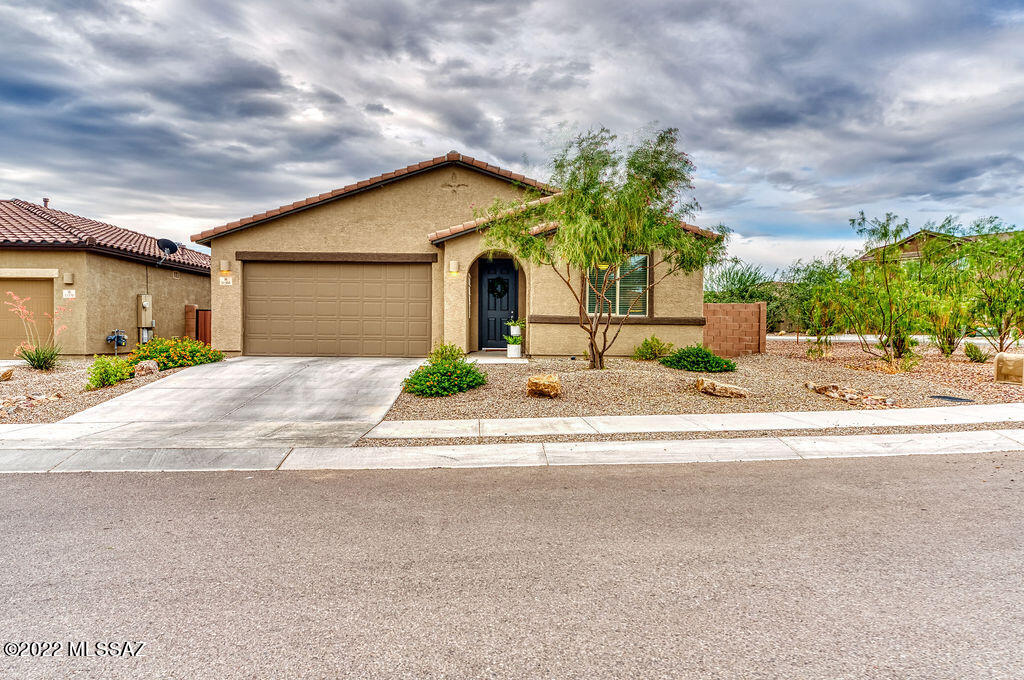 Beautiful Mountain Vail home on a corner lot. This 2223sqft. boasts 3 bedroom 2.5 bathrooms and a den. The large living room has 12ft.double sliding door that leads out to the fully landscaped backyard with extended paver patio and turf area. The stunning white kitchen featuring; stainless steel appliances, quartz counters, honeycomb tile backsplash, island with bar seating, modern pendant lighting and large pantry. The Plank tile is in all the right places. The primary bedroom has a full ensuite bathroom with soaking tub, separate shower, and large walk-in closet. This house has a 2.5 car garage that would be perfect for a home gym, workshop, or room for your toys! This house has it all!