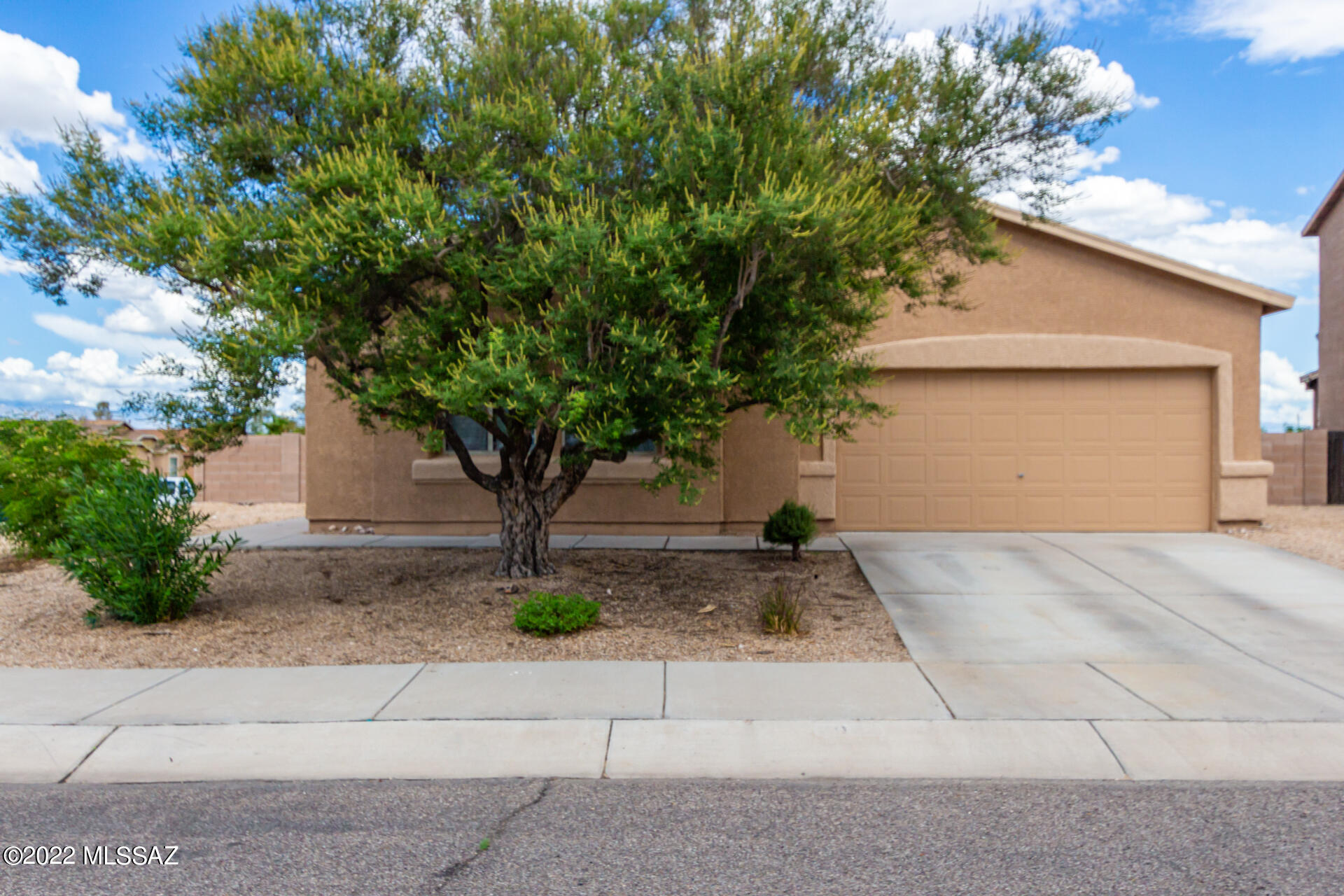 Welcome to Presidio Vista! Nice, quiet subdivision nestled in West Tucson. Amazing home sitting on a premium corner lot is now looking for its new owner! Bright & spacious interior provides a perfectly flowing layout with soothing palette, tall ceilings, tile & carpet flooring, charming light fixtures, archways, & sliding glass doors leading to the backyard. Delightful kitchen is equipped with lovely wood cabinets, appliances, a pantry, ample counter space, & a 2-tiered island w/a breakfast bar. Relax in the primary bedroom offering a private bath w/dual sinks & a walk-in closet. Have a cup of coffee under the covered patio in the perfectly-sized backyard! Get an up-close look today. Book a showing now! New HVAC 1 year ago. Completely New Roof in 2020. Home Exterior painted 1 year ago.