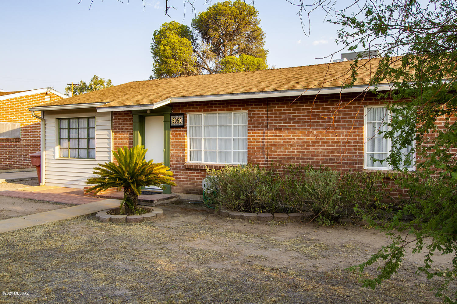 Super cute, wire-cut brick ranch. Convenient mid-town location. 3 Beds/1 Bath. Smart tile throughout. Original and well-maintained pink and black bath surround. Original casement windows. Coved ceilings in the living room. Restored built-ins in the kitchen and hall. A natty peninsula and breakfast bar in the kitchen. Indoor laundry. Covered patio. Generously-sized yard. Tastefully appointed throughout. This one is affordable, easy on the eyes, and move-in-ready. Call for an appointment today!
