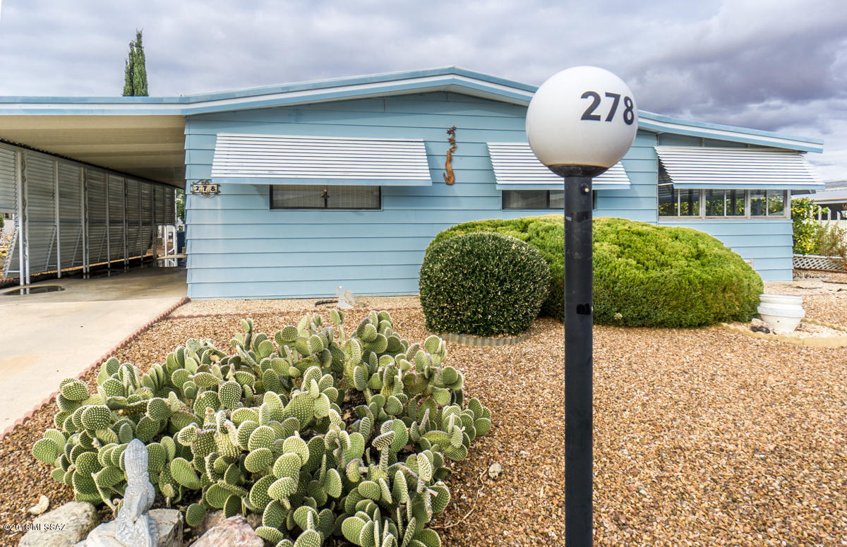 Beautifully maintained manufactured home in the heart of Green Valley. Brand spankin' new AC/Heat pack installed spring of 2017 with 10 year warranty. Enjoy the pool, clubhouse and additional amenities exclusive to this private community in addition to everything that Green Valley Recreation has to offer. Separate den and great room, separated dining and immense storage possibilities. Come to enjoy winter away from the snowplows or as a year round residency in this turnkey home. Enclosed AZ room, added ''craft room'', storage galore (perhaps too much?).