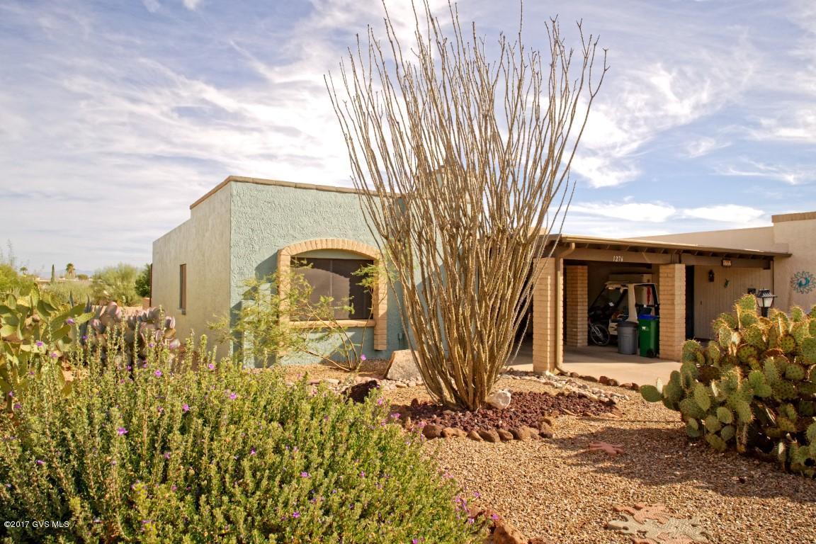 Comfortable townhouse in the beautiful high desert of Arizona. The back yard has views to enjoy of the North East. This home can be made to your liking with just a few upgrades. Perfect Arizona room to relax in or use for hobbies. Galley kitchen made easy for cooking. Exterior paint and roof maintenance 2016. This townhouse will make the perfect winter retreat or year round living. Green Valley Recreation is deeded to this home for enjoyment of the facilities with swimming pools and a lot more. Priced right for quick sale. 
 HOA assessment has been fully paid. Seller concessions for flooring and furniture SBOS.