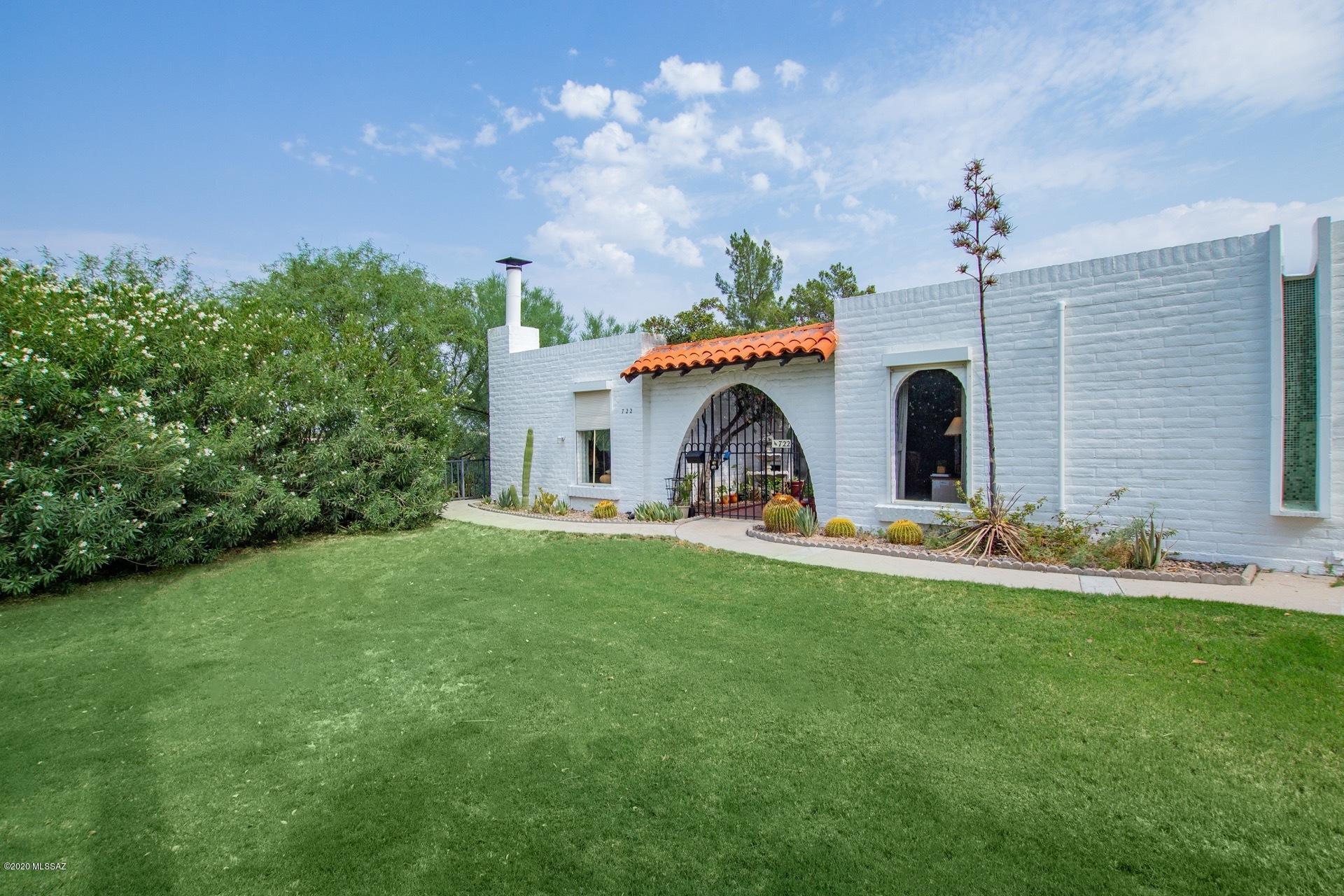 This is an Absolute Gem! This end unit is so quiet & has so much privacy. Spacious 3bed/3bath.You will love the updated kitchen with granite countertops, newer appliances, eat-in sun room. Lovely gas beehive fireplace makes for a cozy family room. Front patio has great views of expansive green grass lawn & palm trees. Nice sized bedrooms. Ensuite for guests. This is a 55+ community with so much charm. HOA covers 2 pools, tennis, clubhouse, maint./painting of exterior buildings, blanket insurance, garbage and water. Covered carport #15 goes with the unit. Make it yours today!