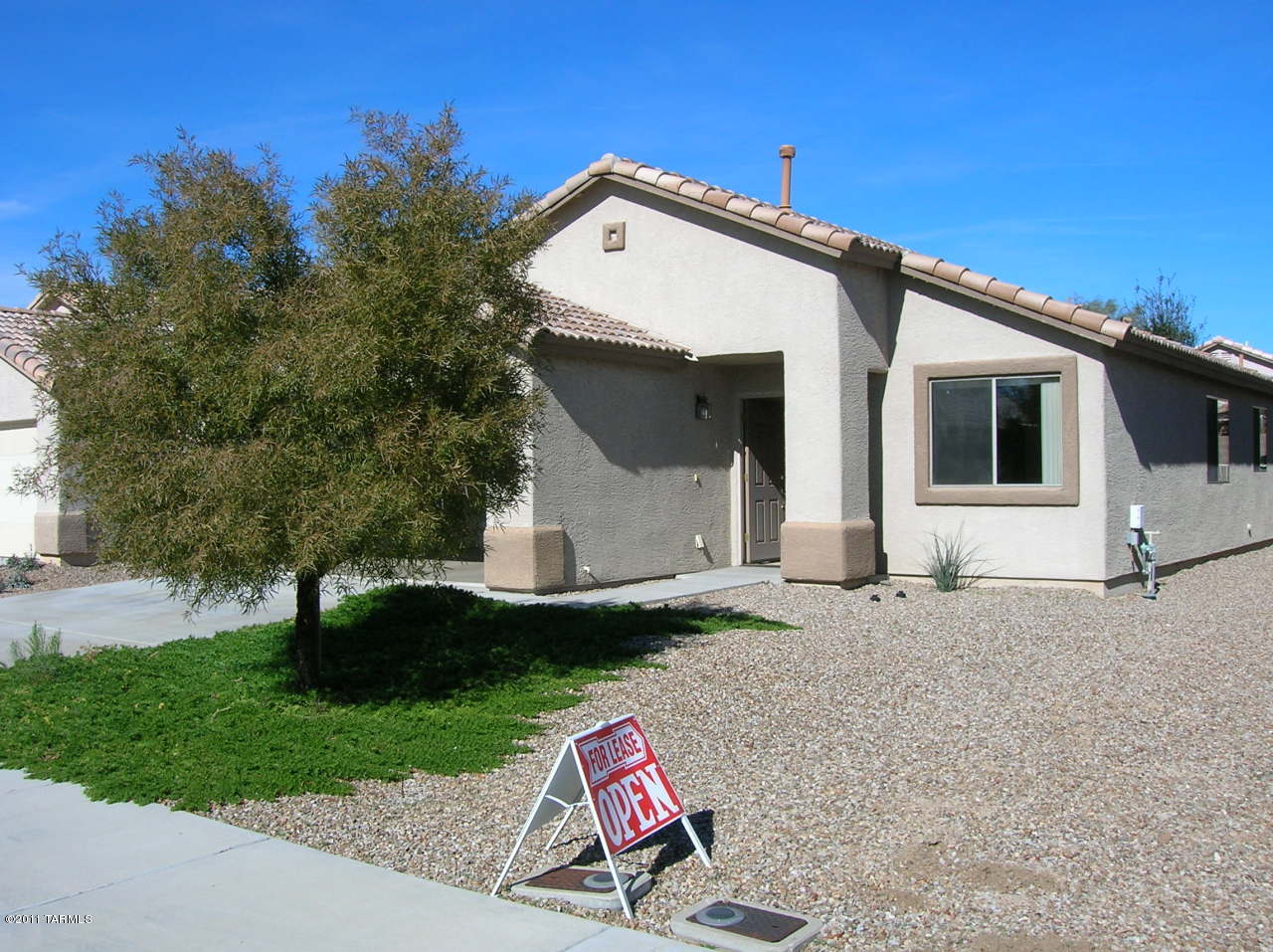 Bright open home with Living Room plus Formal Dining in front of home and Family Room which opens to Covered Patio Porch north facing. Family Room adjoins Island Country Style Kitchen. Kitchen has Oak Cabinets and all appliances, refrigerator, oven/stove, dishwasher, disposal. Plus 3 nice size bedrooms each with ceiling fan. Oh and I forgot the skylights which makes this home bright. Walking distance to YMCA, Pima Community College, and Foothills Mall.