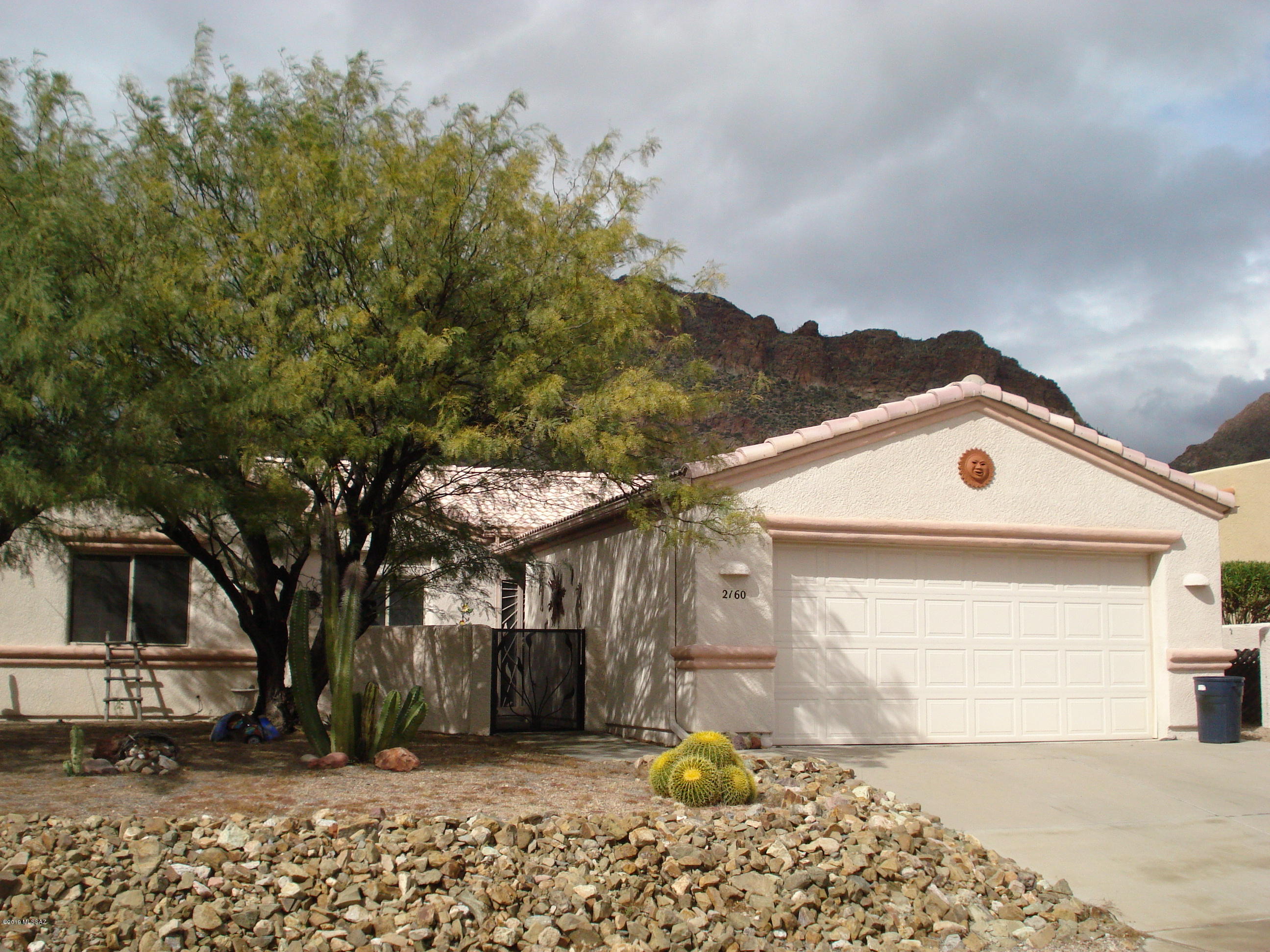 Beautiful Mountain Views!  This 2 BD 2 BA home has been well taken care of.   Enjoy mountain views  from the great room & dining area.  Pleasant easy-to-work in kitchen   There is a den/office. Enjoy your morning coffee on the brick patio!!  The ''Foothills'' are bounded on 3 sides by Tucson Mountain Park. Community Pool & Spa, Tennis Courts and more. 15-minutes to downtown Tucson and many popular venues! Furniture Available