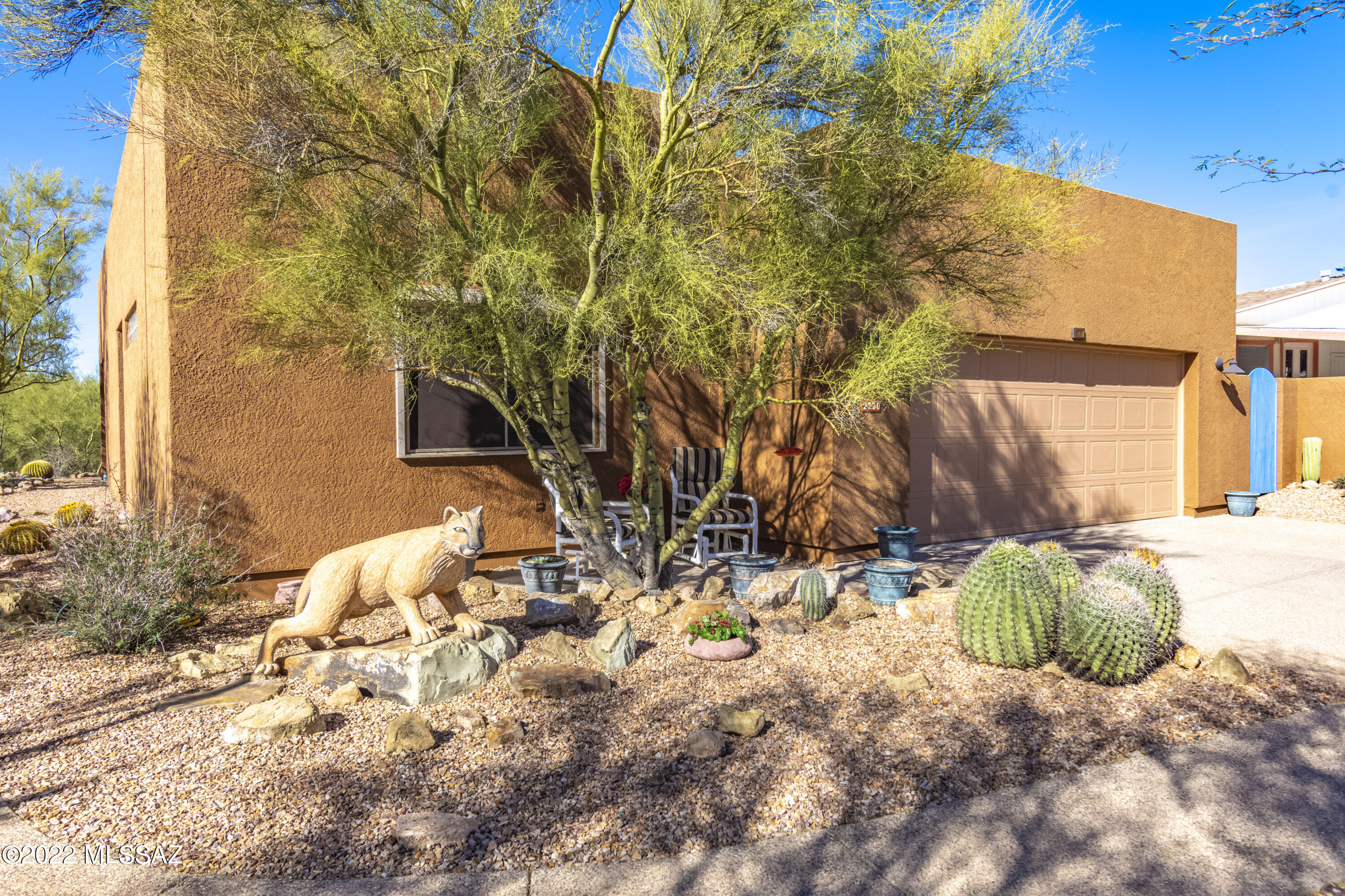 PRICE REDUCED! Beautiful home in the highly desired Tucson Estates No. 2 Community! Large kitchen with a breakfast bar, combo microwave convection oven, plenty of storage and counter space.  The perfect area for entertaining. The master suite is spacious and the master bath provides a large walk in closet with shelves. The guest bedroom has a built-in office and a large closet. Security shutters on all windows.  Large 2 car garage. 30 amp and 50 amp box for an RV. The back yard patio is covered and the views of the Tucson Mountains are breathtaking!! This home is very well cared for and the attention to detail is clear.  Originally designed sculptures enhance and compliment the Sonoran Desert landscape.  A very short walk to miles of hiking trails and only 20 minutes from downtown.