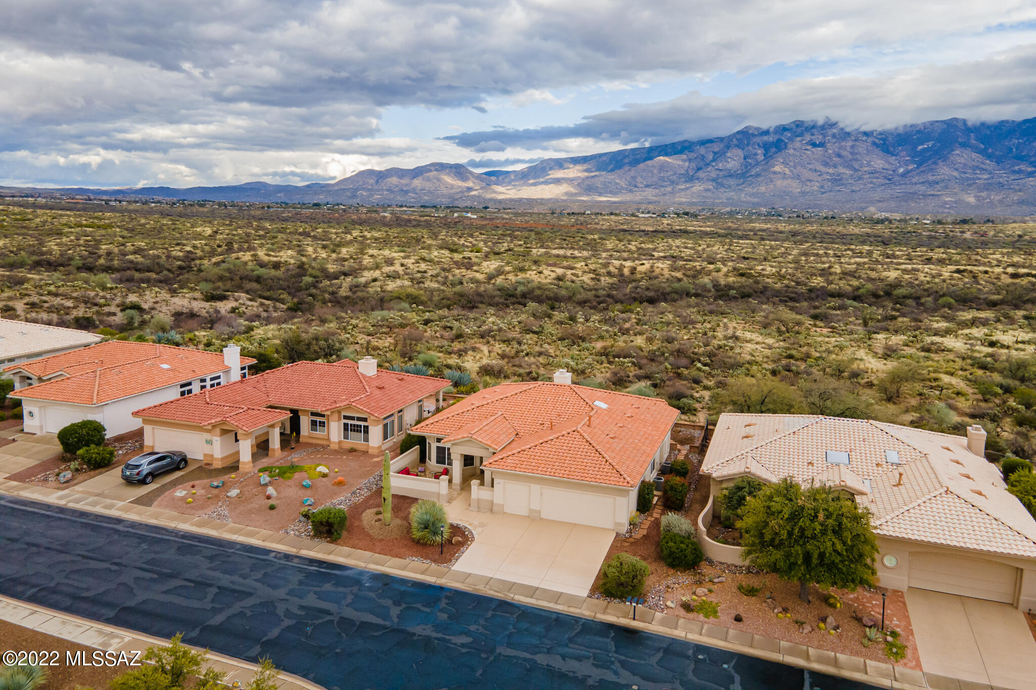 Welcome home!  If you are looking for mountain views do not miss out on this Ridgetop Model-2251 sq ft.  Upon entering you will step into the front courtyard- a great place to enjoy morning coffee.   This home has 3 bedrooms, 2.5 baths. Enjoy the large open kitchen opening into family room where you can enjoy the gas fireplace on cold AZ evening. Take in the mountain views from the family room, kitchen and owners suite. The owner's suite has a sitting area/office. The guest bedroom has its own bath. The 3rd bedroom is great for office or craft room. Enjoy watching the sunrise and the sunsets on the Catalinas Mountains in your east facing backyard.  This home does have the 2.5 car garage cart garage and extra storage.  Roof underlayment replaced & HVAC systems replaced in 2019