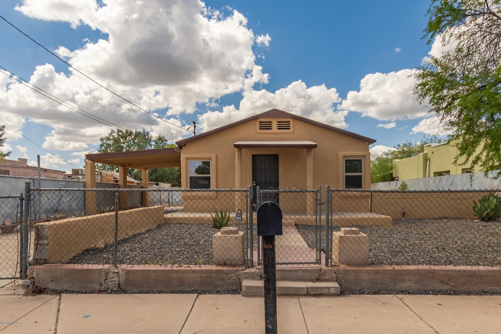 Move in ready and fully fenced in! Gorgeous mosaic tile in the living room. Walk through beautiful archway to enter the kitchen. Galley style kitchen boasts all white appliances, built in microwave and a gas range. Tile flooring throughout. Shower is in cased in tile.  In door laundry with washer and dryer included. Sprawling backyard with a shed.  Do not miss this opportunity!
