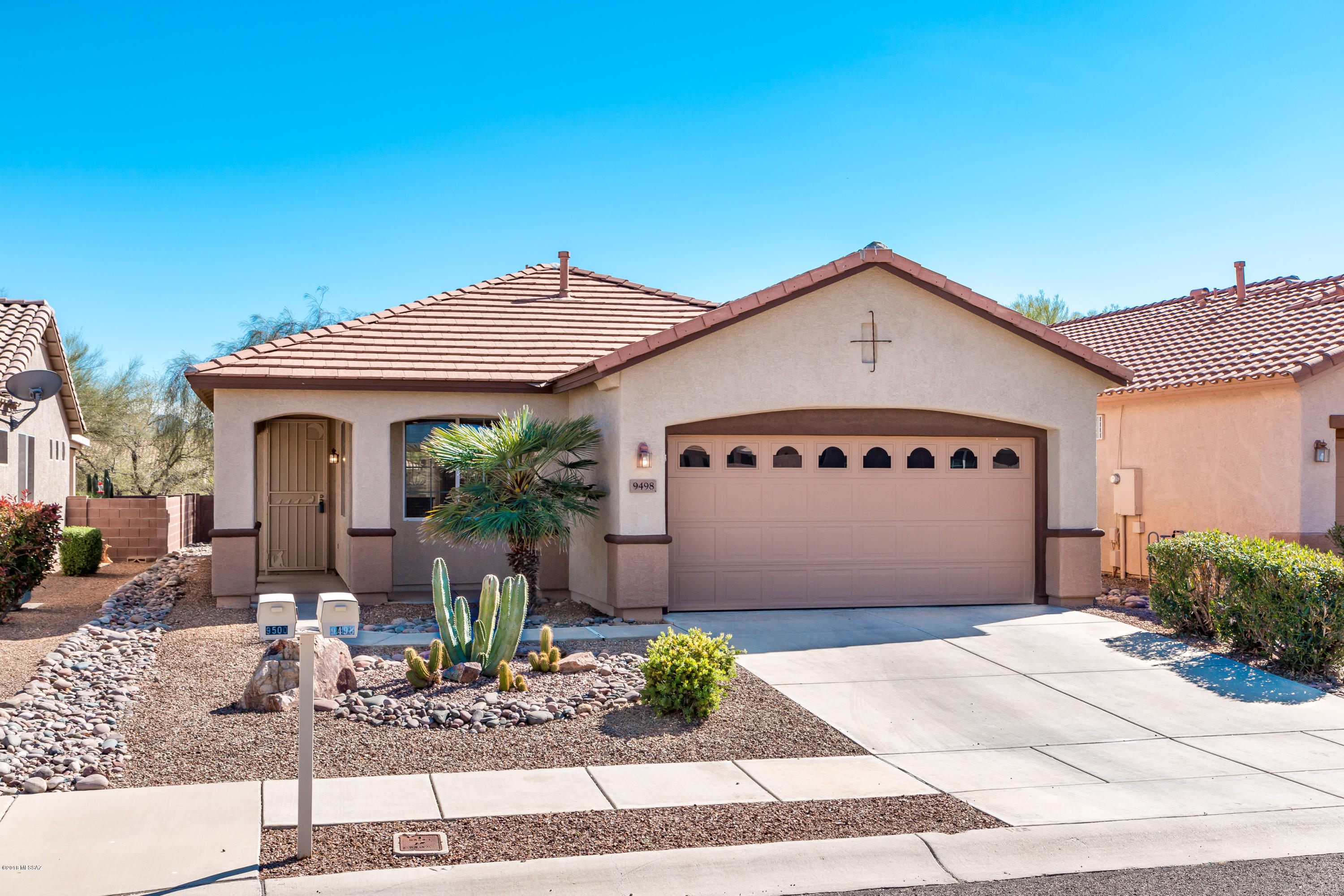 Beautiful, gorgeous and highly upgraded Sedona model home with lovely mountain views and no neighbor behind. The front entry feels thoroughly balanced and anchored by mature landscaping. This well maintained home has numerous upgrades including corian kitchen countertops, paired with a glass backsplash and stainless steel appliances. Neutral ceramic tile on floors with carpet in bedrooms. A gas fireplace pulls the living space together. Den space has pocket door, thus providing  a third bedroom option for guests. Water softener/water conditioner by EVO Clear uses no salt. Private rear patio provides  mountain views and backs  to a common area. Come by today!