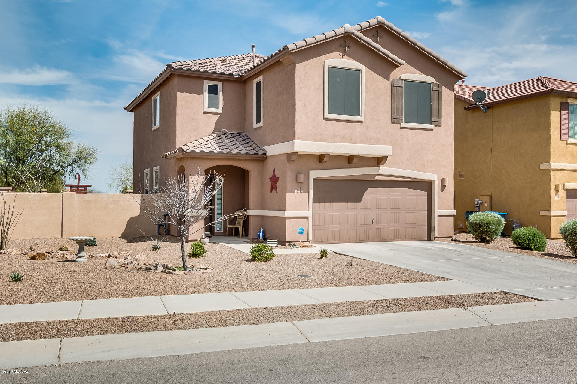 Lovely two story home on large corner lot in desirable Rancho Sahuarita. Yard is beautifully landscaped with pavers,  grass, and gravel area. Four bedroom home, kitchen includes reverse osmosis, granite counter tops, stainless steel appliances. Large master suite with spacious master bath with dual sinks