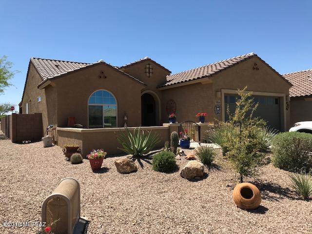 This beautiful home in 55+ Rancho del Lago shows like a model! Upgrades galore! Kitchen features granite, low island, ss appliances, 45'' staggered maple cabinets. Granite wetbar w/ custom cabinets, wine cooler & sink. Decorator colors thru-out, 18'' ceramic in living areas, upgraded carpet in bdrms. Custom cabinets, vanity in mstr bath, exec ht cabinets in both baths. Dbl pane windows,solar tubes, water softener, tankless water heater. Custom gate & security door. Recessed lighting, fans and custom return walls at extended patio. Mntn views in 3 directions! All on a premium corner lot backing up to common area. Community offers golf, fitness ctr, tennis, pools, spa, clubs, classes & more. See ''Documents'' for full list of upgrades and features.