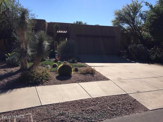 Premium Golf Course lot, mountain views and city lights. Beautiful kitchen with Granite counter tops, custom kitchen cabinets, all new appliances. Nice large den-can be converted to 3rd bedroom. Seller installed additional cabinets in laundry room and garage. Roof recently re-coated, water softener, water filtration system, new bathroom light fixtures, other bathroom renovations, new commodes. Located in beautiful Starr Pass Quail Haven. Close to Pima college, U of A and downtown. Great home for winter visitors, low upkeep, 3 miles from interstate.