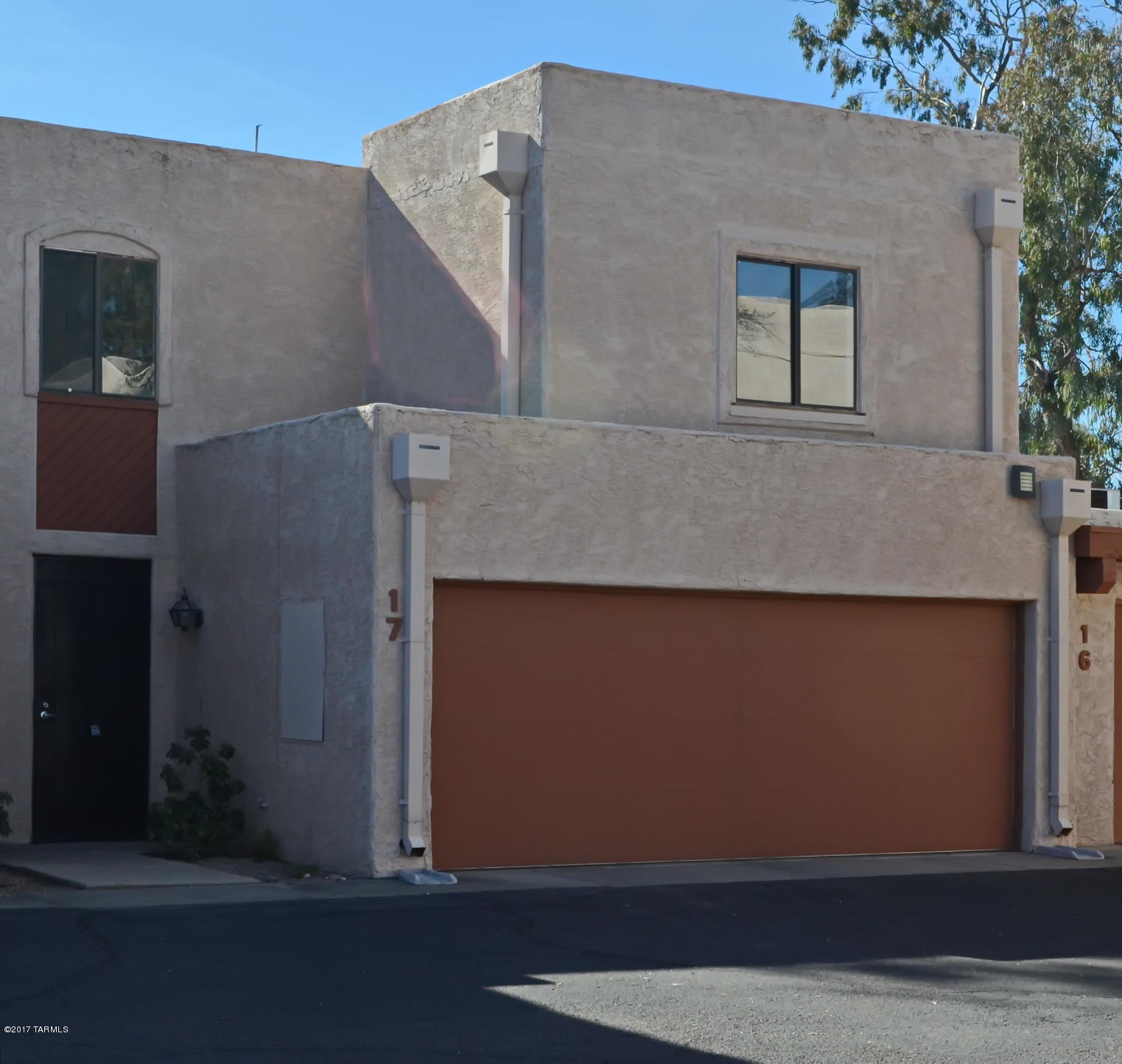Beautiful move-in ready townhouse, very centrally located! Close to schools, shopping, buses, this property is in a secluded and private community of only 34 homes. It has a bright, open floorplan with soaring ceilings, clerestory new dual pane windows, a cozy fireplace, separate computer alcove, private balcony off the master bedroom. New carpet, new tile, very clean and ready for you to move in right away! Wrought iron security gates in front and back. Two car garage with plenty of storage throughout. This is a must see! Seller will pay six months of HOA dues at closing!