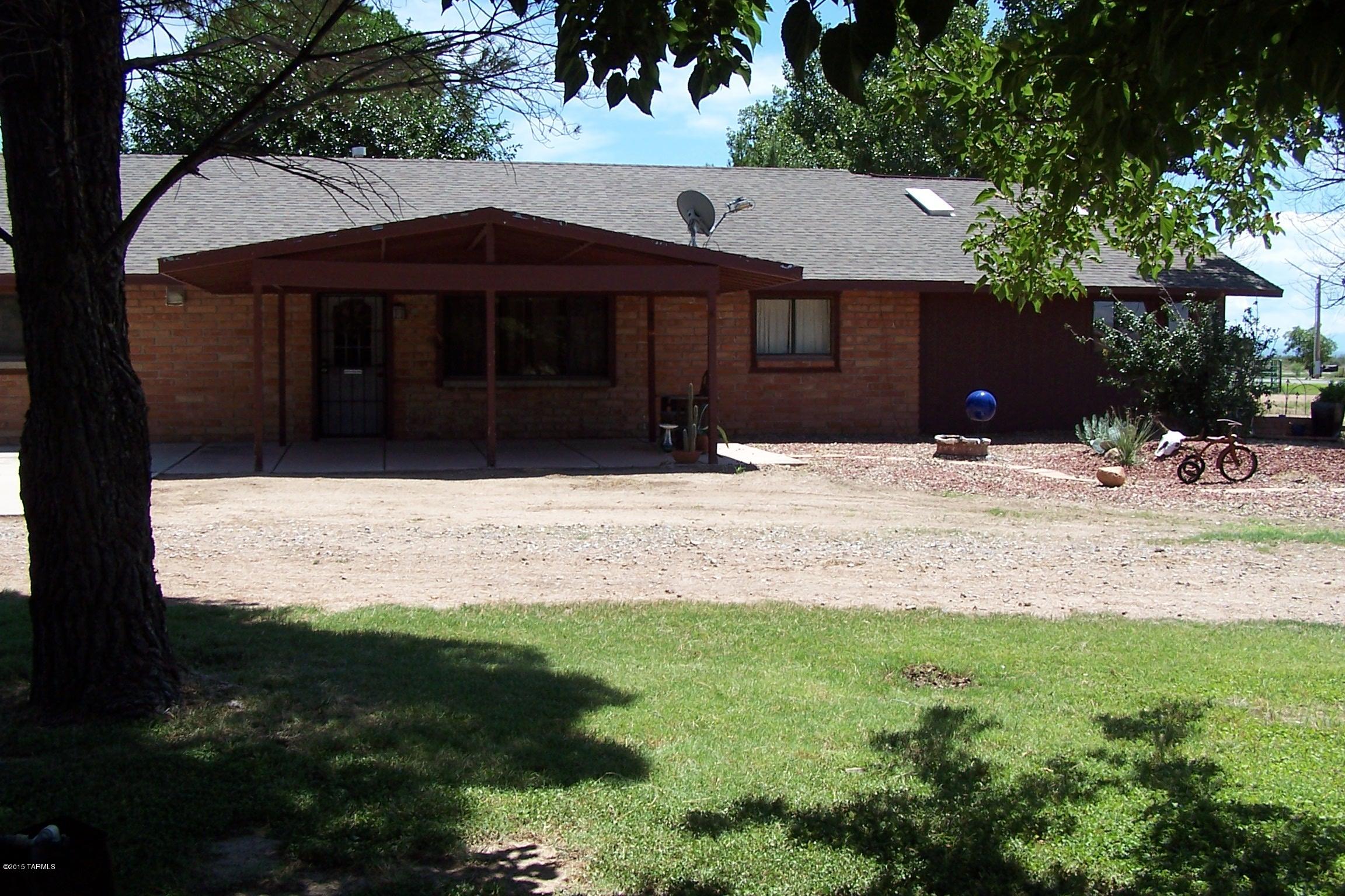 Absolutely beautiful 4 bedroom 2 bath home with lots of personal and unique touches such as the mosaic tile around the bathroom mirrors and wood burning stove in the living room. Large kitchen with Oak cabinets with open floor plan to dining room & Living room. Master bedroom is very large with 3 closets and 2 skylights for natural lighting.  The fenced in back yard is the perfect place to relax after a long day, plenty of grass & fenced areas for kids, pets etc.  Large horse pastures with stalls.  Call listing agent today to set up an appointment to see this home, I don't think it is going to last long on the market at this price.