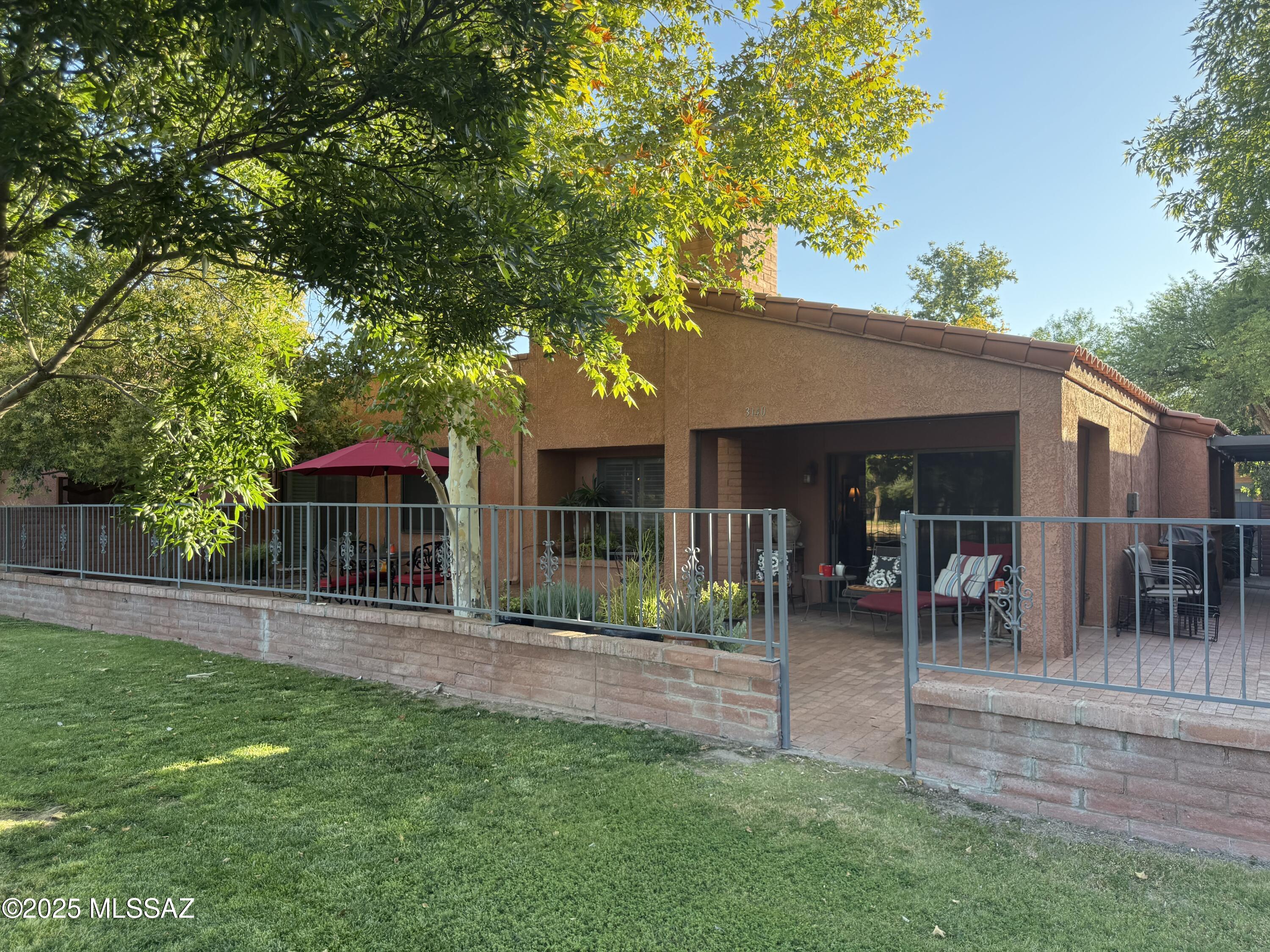 Lake house within private lake community in Fort Lowell Historic District