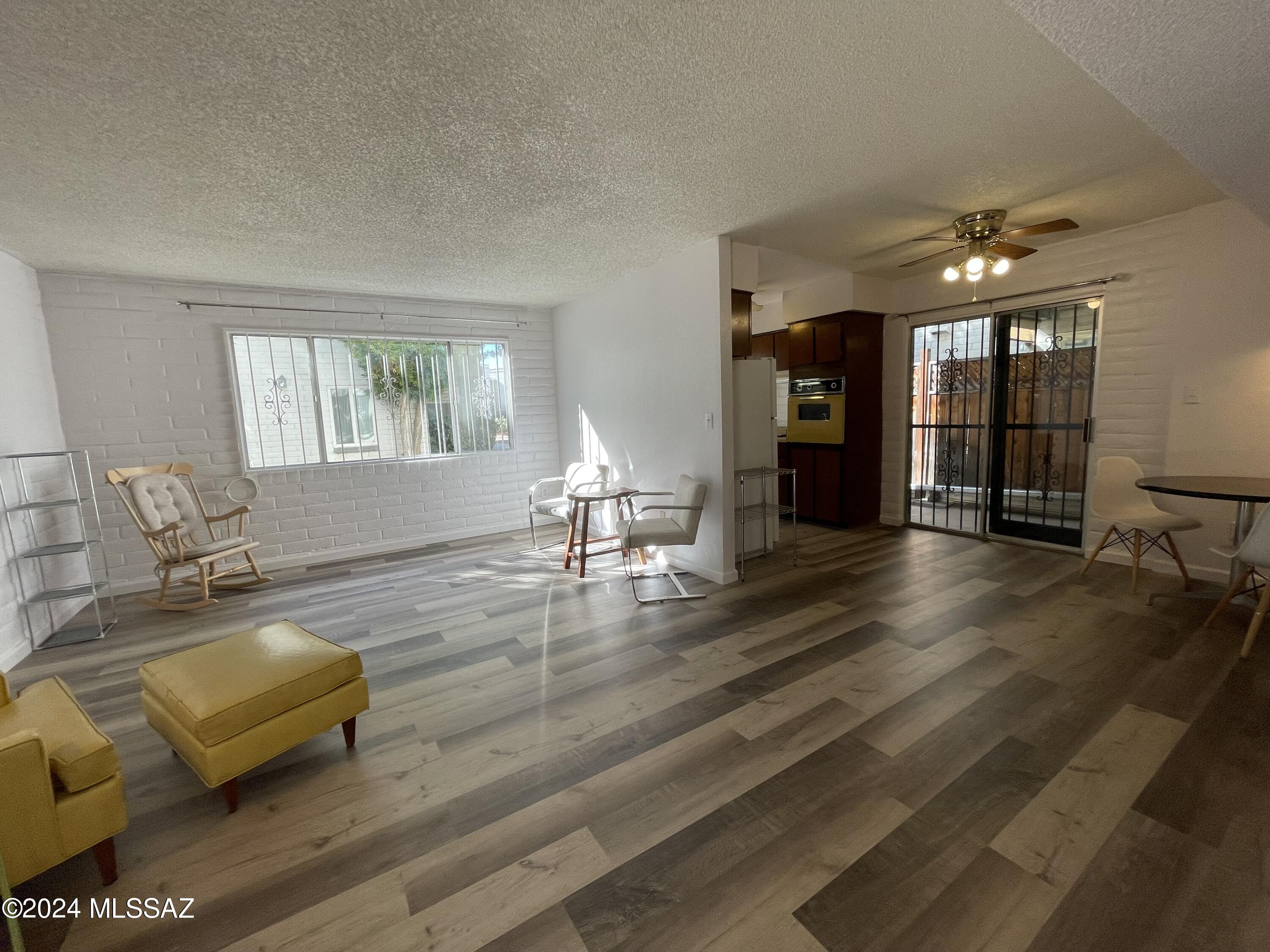 This bright, ground level condo is located in a nice quiet spot in the East side of Tucson. It has one bedroom, one and one half baths, 958 square feet of living space, new luxury vinyl tile flooring and fresh interior paint. The HOA fee covers a lot, including water (both hot and cold), the pool and spa, the  exercise room, community laundry room, trash collection, common area insurance, utilities, pest control, exterior, roof and grounds maintenance. The assigned carport space is #15, which is very close to the unit.  This is  a great opportunity.