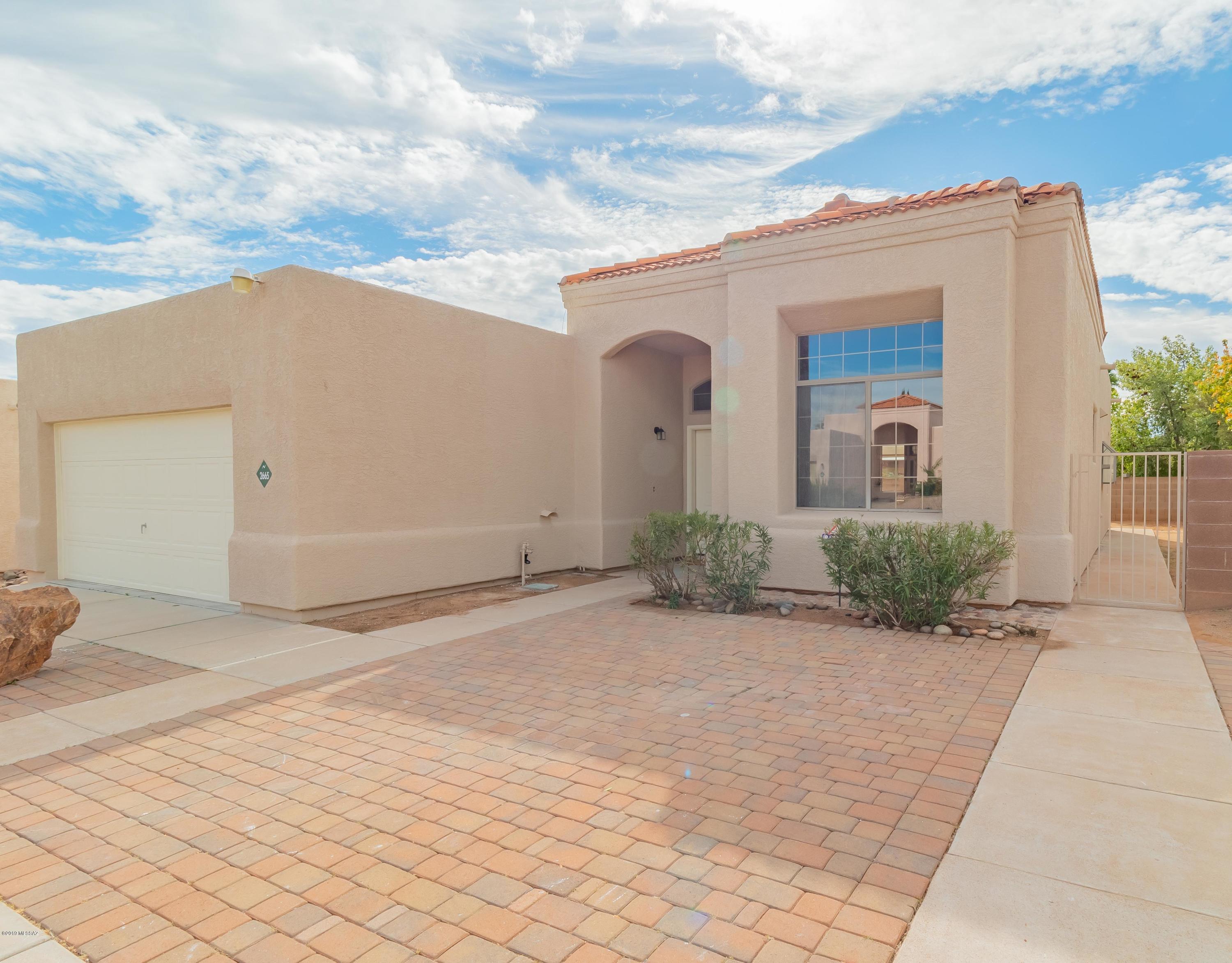 Seller will accept or counter offers from 234,900-239,900. Come view this wonderfully remodeled home located in Northwest Tucson! This home showcases a gorgeous grey and white color scheme along with tons of upgrades! Inside of this home you will be greeted by vaulted ceilings, and  brand new tile tile all throughout the living areas as well as the hallways. With a separate family room and dining area in the front of the house, you will surely have plenty of room to entertain your family and friends. The kitchen features lovely cabinetry along with stunning white granite countertops to compliment the gorgeous color palate. Both bathrooms have been completely redone with matching granite countertops and beautifully tiled showers.