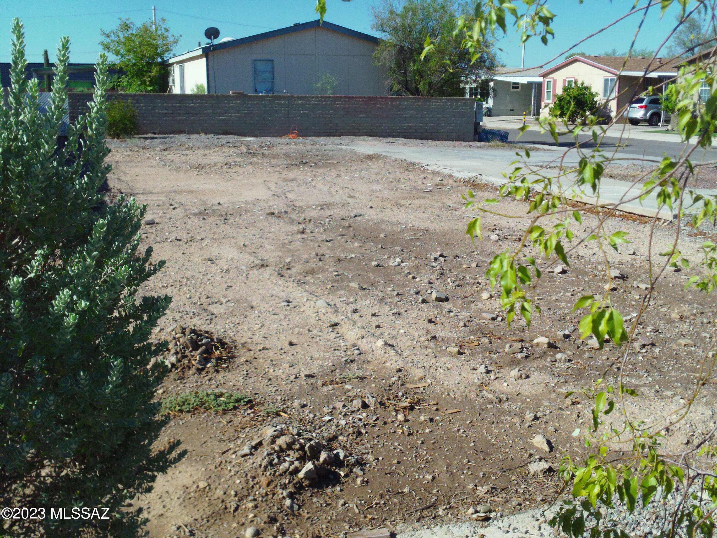 Wow, a great lot ready for your Own Manufactured Home! Buyers' Opportunity to own in this absolutely Wonderful Neighborhood! All Utilities on Site: Flowing Wells Water; T.E.P. Electric; Southwest Gas; Tucson Sewer.  Owner Carryback Financing Available. Place your Manufactured Home! HOA will have to approve your choice of MH--send pics! Typical sized manufactured home SIZES that should fit are: 28ft X 60ft or close to it.