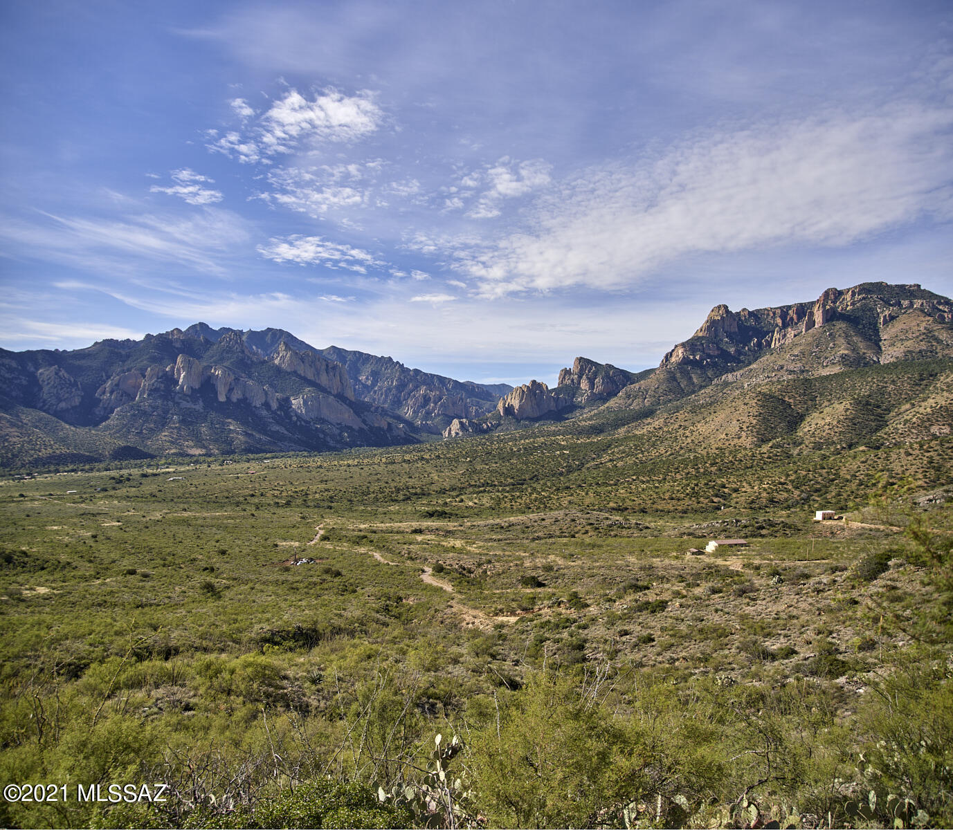Hill Side Build Site with breathtaking views into the mouth of Cave Creek Canyon. HUGE PRICE REDUCTION! Awe-inspiring views of the mouth of Cave Creek Canyon,''The Yosemite of Arizona'' in the Chiricahua Mtns. 8.45 acres w/great access off of paved road, DSL/phone, at lot line. Elevation 5500'. Portal area boasts some of the darkest skies in the nation, incomparable star gazing! Bring your telescope. Local county ordinance keeps light pollution at a minimum. Vegetation is ocotillo, yucca, agave, juniper, w/some mesquite mixed in. Adjacent 50' deep slot canyon to explore. Close knit community consists of astronomers, birders, scientist from many disciplines. SW Research Station sponsored by American Museum of Natural History is a biological field station that provides, research