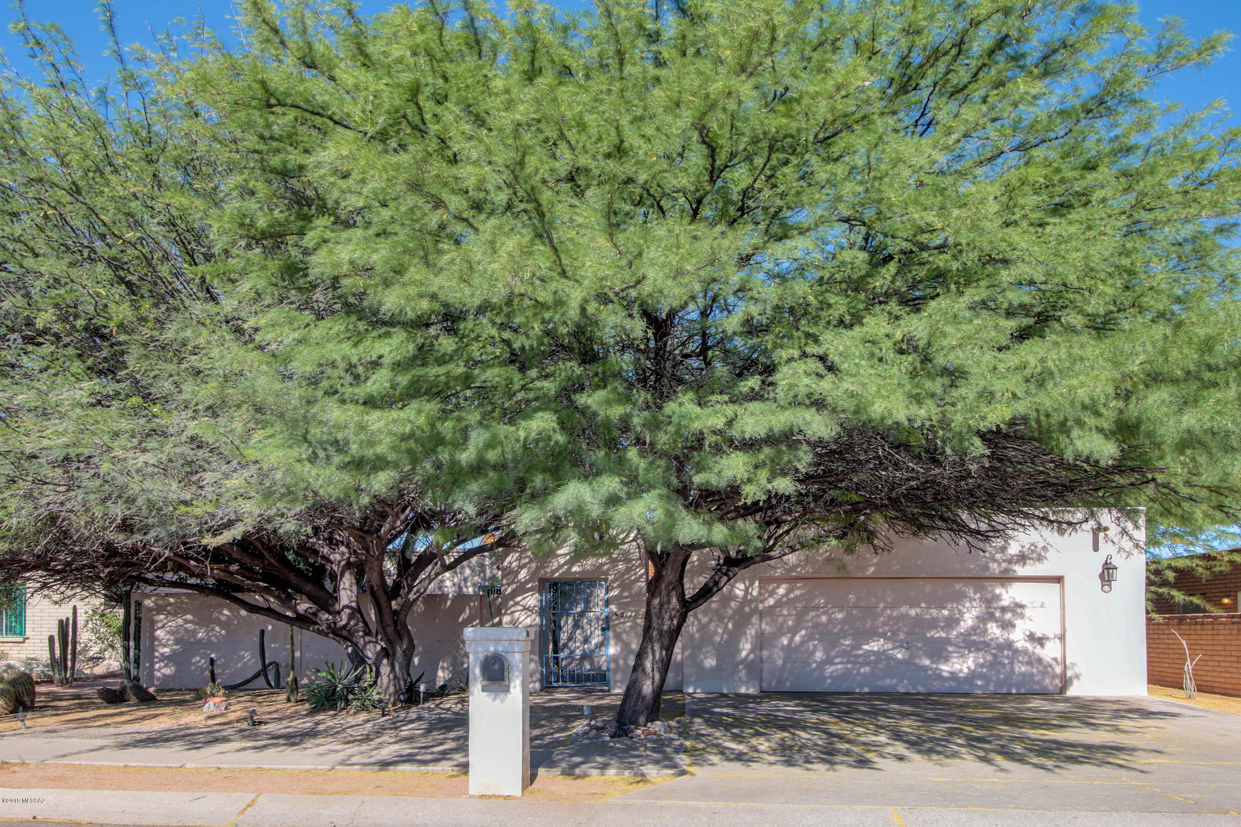 Beautiful 3 bedroom, 2 bath home. Udall park is just around the corner, the home is an urban oasis. You will love the enchanting front courtyard featuring a fountain and lush flower beds, landscaping is included. Inside, a generous eat-in kitchen has been updated with a SS gas cooktop/hood, stylish backsplash, fresh paint and rich wood cabinetry.Carpet has been removed from the dining and family rooms and replaced with beautiful wood laminate. Bright and cheery! Master suite includes a walk-in closet and en-suite bathroom. Covered patio and mature landscaping create the perfect setting for moments of quiet reflection or hosting a BBQ. Stellar mountain views to top it all off! ** Landscaping Services Included**