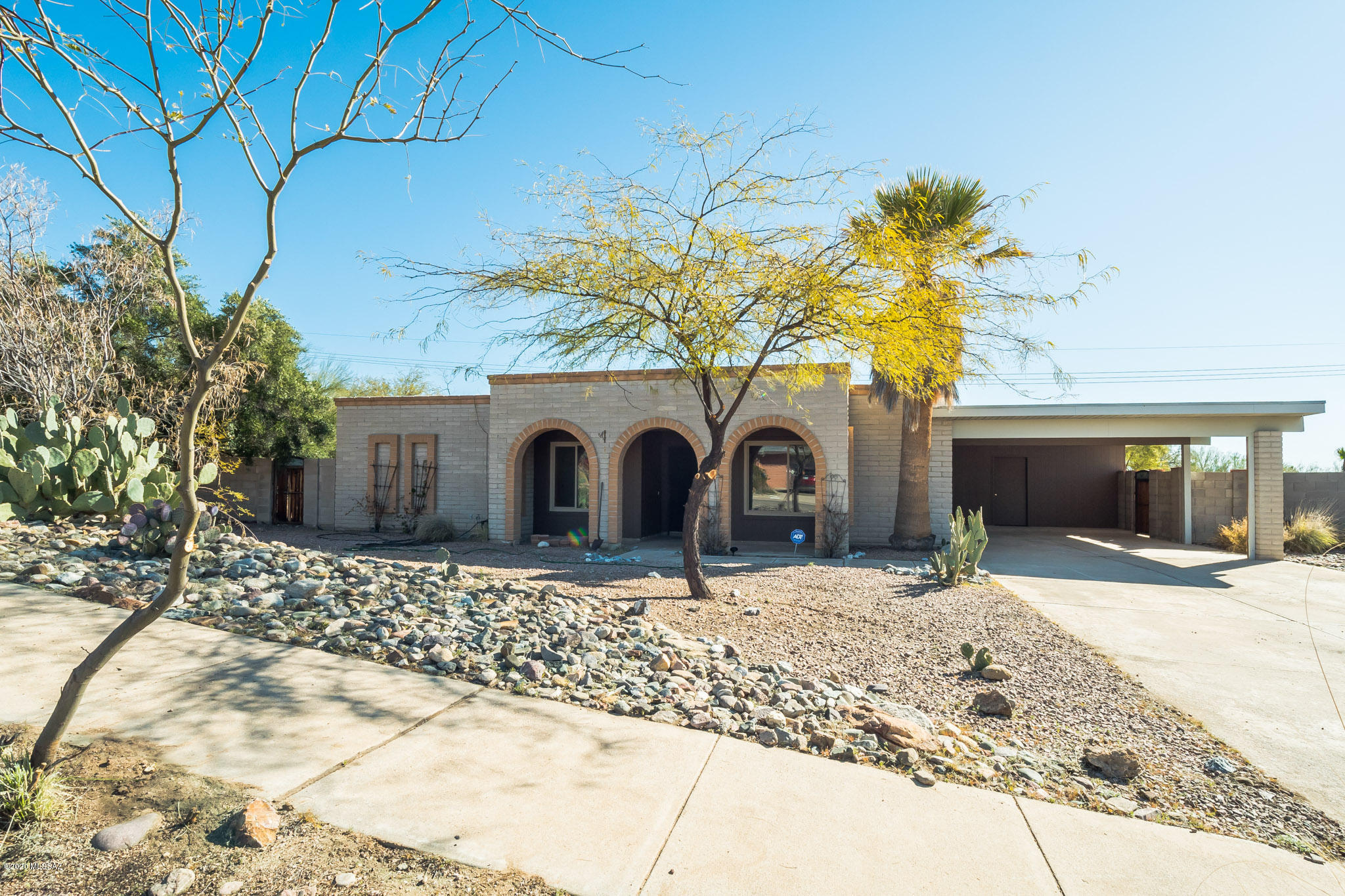 Make this beautiful, recently updated, home yours located in Tucson's highly desired North-West side. Situated on over 1/3 of an acre, privacy awaits! Enjoy the large corner lot, with no shared backyard walls, all to yourself as you sit beside your beautiful pool! Don't forget the amazing views of the Catalinas and the city. On the interior, there are two living spaces and two dining areas. Two bedrooms received brand new LVP flooring, and enjoy the hardwood floors in the master! Adjacent to the carport is a large storage room which can easily be used as a workshop. This home has so much to offer! Don't miss out!