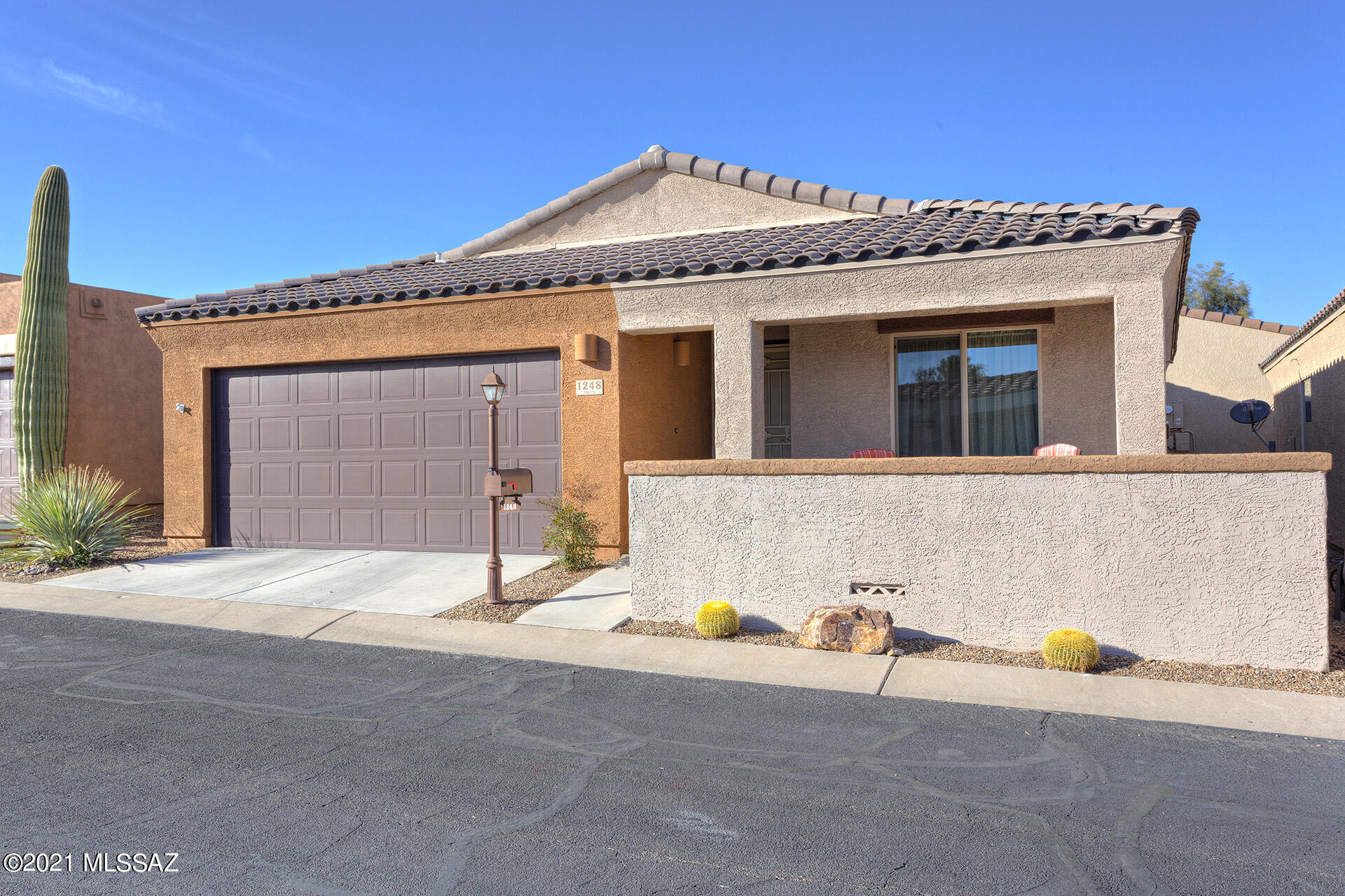 This fabulous home is in like-new condition and has all the right updates! Situated in the 55+ gated Rancho Resort community, this DR Horton home's features include a beautiful front courtyard and a 2 CAR GARAGE. Built in 2016 and updated with new flooring in 2019. Spacious kitchen with pantry closet, beautiful granite countertops and upgraded cabinets. Open living room and dining area. Bathroom features a large walk in shower and vanity with 2 sinks. Feels more spacious than the stated square footage. Enjoy some mountain views from the front courtyard. All appliances are included! Spacious laundry closet with shelf. No backyard, to maintain, leaving more time for you to play, relax and enjoy your sunny Arizona lifestyle! Community amenities are close by, including a gorgeous pool, clubhouse, pickle ball courts and much more! Easy access to shopping & I-19.