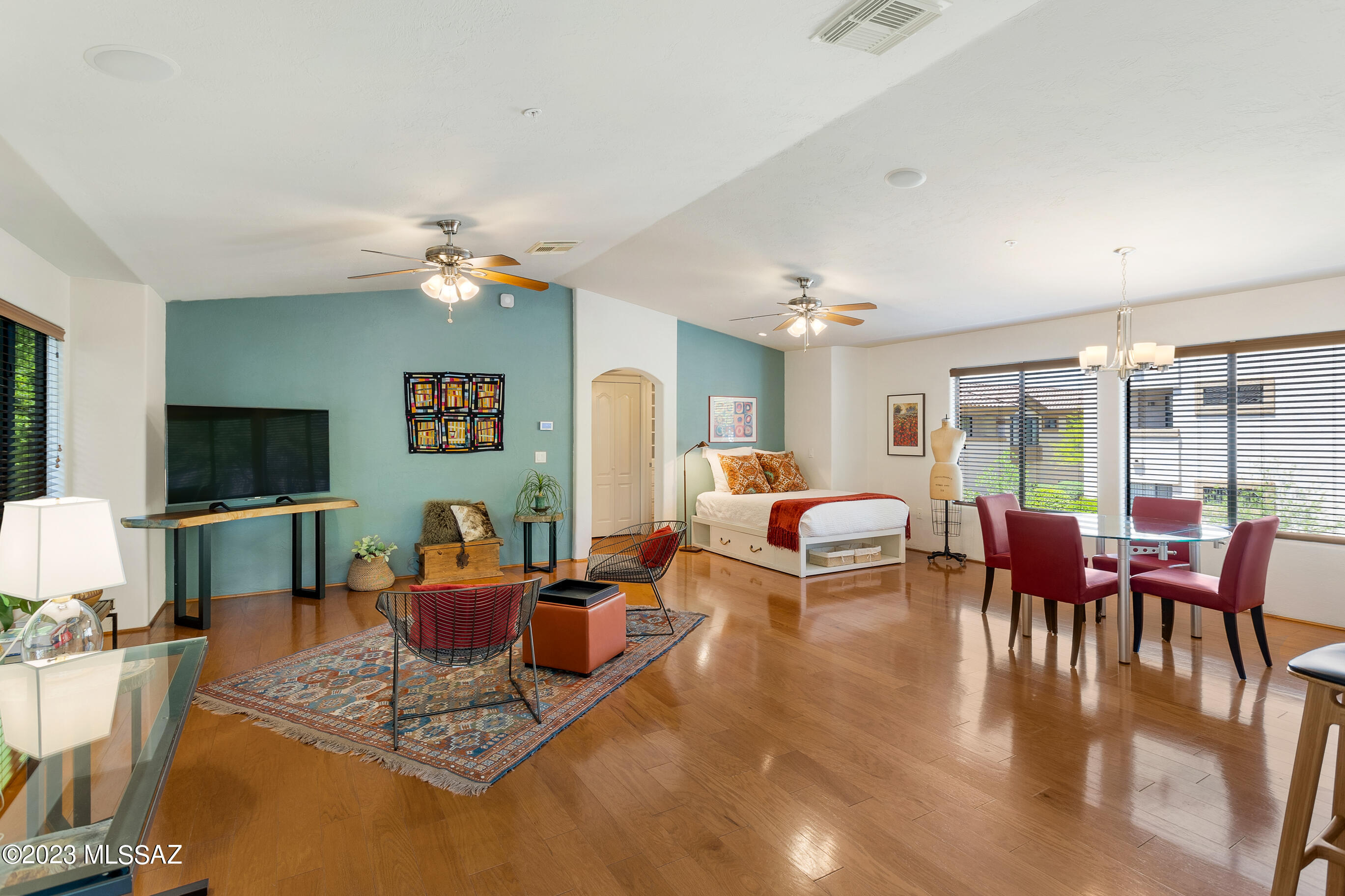 True Gem - Rarely on the market, updated corner unit loft nestled at the base of the Foothills in the gated Villas at Hacienda del Sol (Rio del Sol).  A quiet, pet-friendly community convenient to numerous popular Tucson attractions and just steps to the Bike / Walk Loop and St. Philip's Farmers' Market.  Enter into a bright, open, and airy entryway with direct access to attached garage (this is 1 of just 14 units out of 100+ with an attached garage).  Nature surrounds the unit with lovely mature trees.  Updated kitchen includes GE Profile induction range, Bosch dishwasher, gleaming granite counters, custom open shelving and ample kitchen storage with pull-outs in all cabinets. Wood flooring throughout (tile in bath), and designer walk-in closet by California Closets. Bath boasts elegant tiled walk-in shower and roomy bathroom cabinets. The attached extra-deep garage features raised cabinets & Wi-Fi garage opener. Separate exterior storage space for bikes/gear. Newer HVAC (2019-transf. warranty).  Laundry closet inside unit is large enough for full size washer / dryer - no more trips to the laundromat!  Enjoy resort-like amenities: clubhouse, fitness center (w/ locker rooms), two pools, Jacuzzis, and BBQ grills. Ample guest parking next to unit. Ideal for an easy, carefree lifestyle near shopping, restaurants, and more. Don't miss this opportunity, call for easy showing.