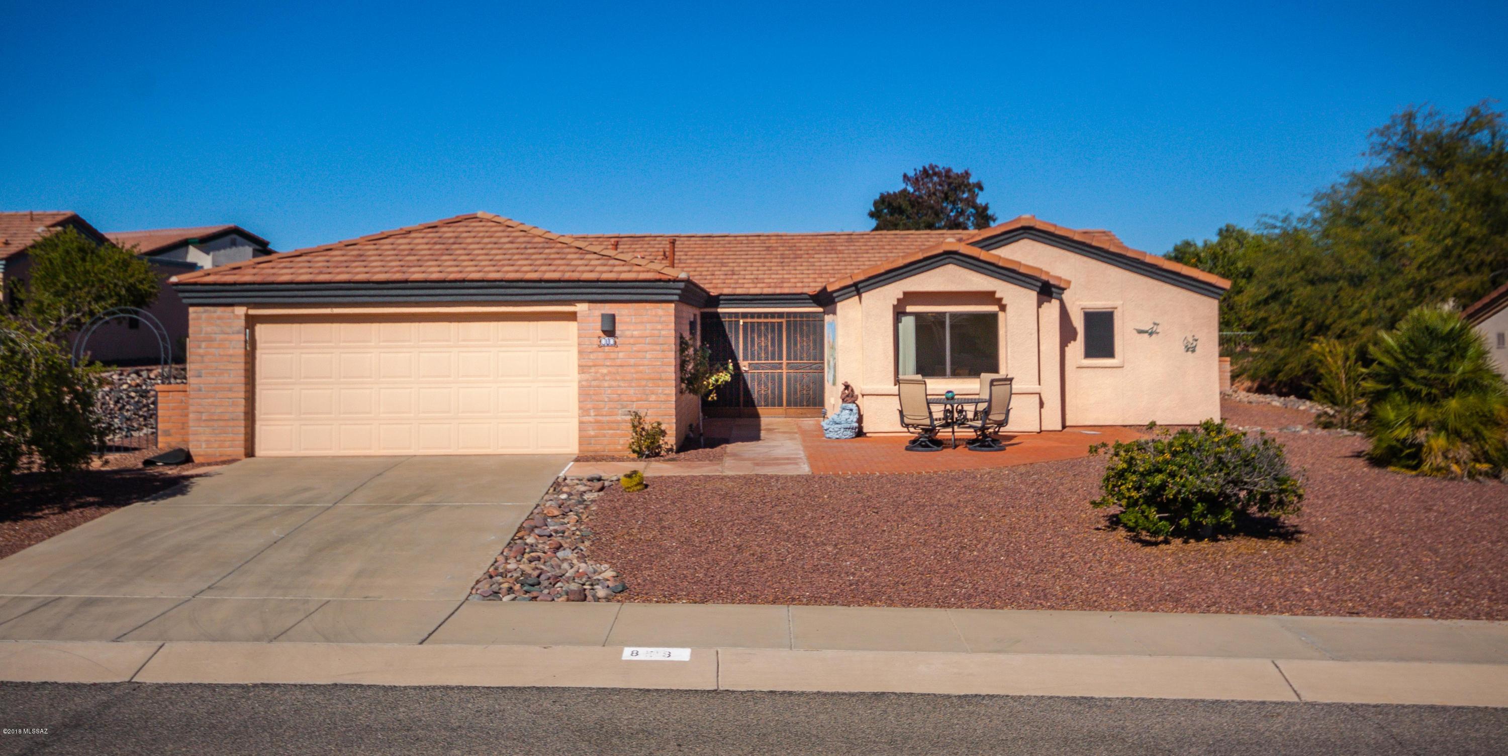 Spacious 1957 sq ft home has upgrades throughout and sits on an oversized 10,000 sq ft. lot. Beautiful wood floors in the kitchen/great room area, which includes a fireplace, built-in TV area. Vaulted ceilings and upgraded carpeting in living room and bedrooms. Stainless Steel Appliances and new Washer/Dryer. You'll enjoy entertaining your guests in either the formal dining room while overlooking the backyard or in the large Screened Arizona Room.  2 Master Suites so both you and your guests will have their own private retreat with a view.  Bonus desk/ office area off the great room and laundry room with upgraded cabinetry. Sparkling epoxy floor in garage with an abundance of built-ins  cabinets, a utility sink, + extra alcove for either your golf cart or storage.