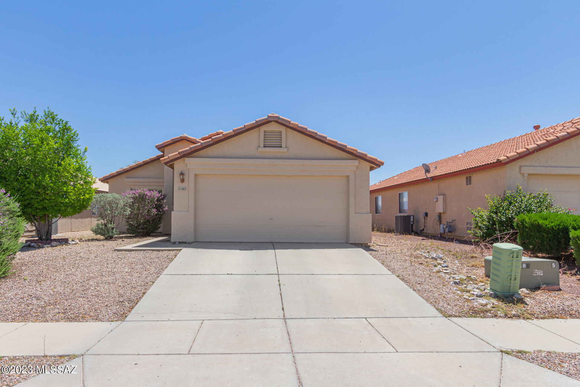 Charming 2 bed, 2 bath residence located in West Tucson! Discover a welcoming interior showcasing wood-look floor, soothing palette throughout, and sliding glass doors opening to the back patio. Vaulted ceilings are sure to impress. The pristine kitchen  boasts white cabinetry with crown moulding, stainless steel appliances, track lighting, stylish tile backsplash, and granite countertops. Retreat to the primary bedroom comprised of a private bathroom and an ample double-door closet for added convenience. You'll love hosting family gatherings in the spacious backyard.