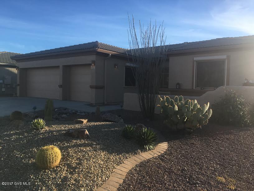 WELCOME HOME to beautiful Canoa Northwest! Gorgeous open floor plan with tile throughout. Corian kitchen counters, gas range, large eat-in kitchen with double pantry. Functional office off kitchen. Large Master Bedroom with Bay Windows and access to beautiful screened Arizona Room. Updated master bath with large soaking tub and executive height counters. Rolling shutters for comfort and safety. Security screens both front and back. Reverse Osmosis, water softener, solar screens, custom storage in garage - the list goes on! 3 car garage. Gorgeous mountain views from backyard. Nice large corner lot! Pride in ownership shows in this home - make it home today!
