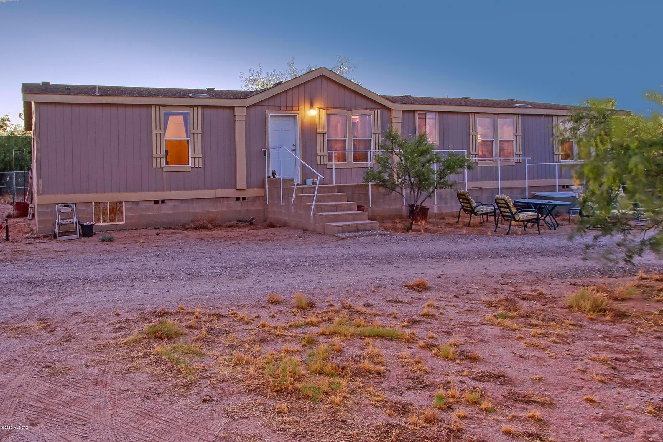 Welcome home to your own horse man's paradise, located in secluded western Avra Valley this lovingly cared for 2300+ square foot home is ready for you and your family.
 

 Exterior amenities include: a 3 acre pasture enclosed with field fencing with a large metal enclosure for shelter from rain or sun, 3 stalls with water outlets at each. A 3/4 acre paddock fenced with white 3 rail fencing, solar powered front gate. Backyard is approx. 1/4 acre, fenced with chain link and includes power pedestal for an RV, a 20x20 shed... and covered parking for 2 vehicles.