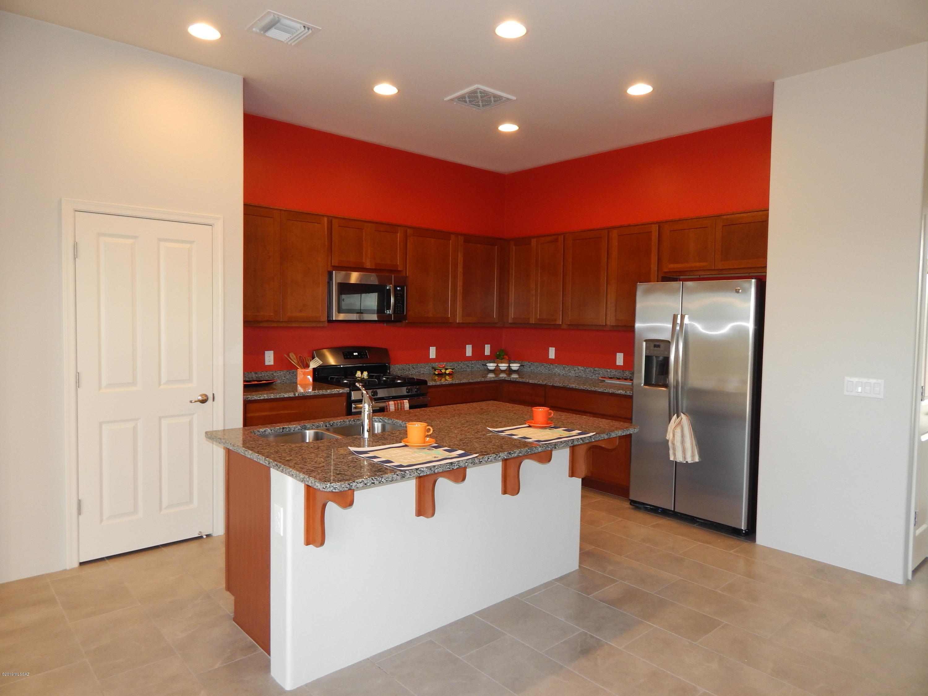 OVER 55!  NEW BUILD! 3 Bedrooms - 2 Bath Home  in Acadamy Village Community. Easy open floor plan with lots of overhead lighting & windows for natural light. Kitchen features Gas Stove and Stainless appliances, Breakfast Bar. Walk out onto covered patio through the French Sliding Doors.  Master bedroom has large window for natural light and large walk in closet off bathroom. Dual Sinks, and Glass Shower Stall. Two other bedrooms at other end of house - Split Bedroom Plan, Hall bathroom has tub/shower. Natural Desert plantings surrounds back yard area.  NO FENCE on back yard. Please call with pet requests.  Tenant will receive all amentities for the Acadamy Village Altura and the Arizona Senior Acadamy.  RELOCATING OR BUILDING A NEW HOME -  SHORT TERM LEASE AVAILABLE.