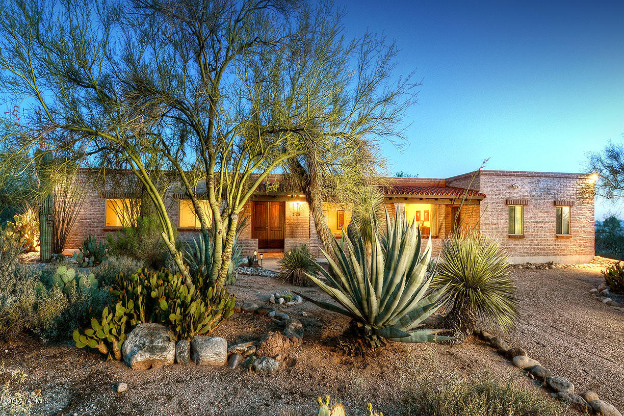 CHARMING REMODELED BURNT ADOBE “TERRITORIAL” WITH MOUNTAIN VIEWS AND DIST. 16 SCHOOLS IN THE HIGHLY DESIRABLE CATALINA FOOTHILLS EST.#8. FRONT VERANDA, EXQUISITE LIVING ROOM & FORMAL DINING ROOM WITH LARGE PICTURE WINDOWS, HIGH CEILINGS, LIGHT & OPEN KITCHEN W/GRANITE COUNTER TOPS, STAINLESS STEEL DOUBLE OVENS, REFRIGERATOR, LARGE FAMILY ROOM W/FIREPLACE, BREAKFAST AREA, ALL TILE & STAINED CONCRETE FLOORS (NO CARPETS), 4 BEDROOMS (SPLIT PLAN), 3 REMODELED BATHS INCLUDING LARGE MASTER SUITE W/FIREPLACE, LUXURIOUS BATH W/GRANITE COUNTER TOPS/DBL SINKS AND WONDERFUL CONTEMPORARY WALK-IN SHOWER. ENJOY THE RESORT LIKE BACKYARD W/COVERED PATIO, POOL, WATER FEATURE, RAMADA, LUSH LANDSCAPING & MT. VIEWS. FLOOR PLAN LOCATED UNDER PHOTOS/VIRTUAL TOUR.
