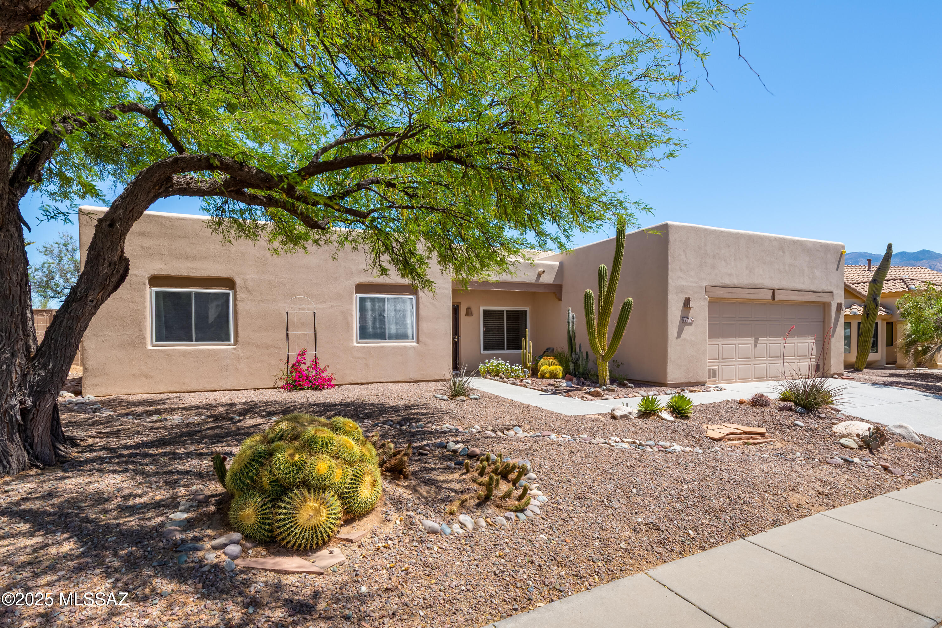 Catalina Shadows in Oro Valley, 1,971sf, 3BR, 2½BA single-story home backing to open space with no homes directly behind with Catalina Mountain Views. Kitchen is open to the family room & casual dining  area with white appliances, Viatera Quartz counters, Fasade   thermoplastic backsplash & island with bar seating. Formal living/dining area with coffered ceiling. Primary suite has jetted tub, separate shower & large walk-in closet. Backyard has  covered patio, shed, block fence, gutters & low care landscaping. Expanded & extended 2-car garage has laundry sink, workbench, storage shelves & cabinets. Recent updates include Newer HVAC (April 2024) with transferable warranty, Newer HW tank (March 2024), Roof recoated (Aug 2023), new durable polyaspartic coated driveway & walkway (Jan 2025), newer Harris Tarkett oak flooring, newer faux wood blinds. Terrific location located near shopping, dining, medical, theaters, bike trail, Oro Valley Market Place/Village Center & Catalina State Park. All appliances stay. One year home warranty offered to the Buyer.