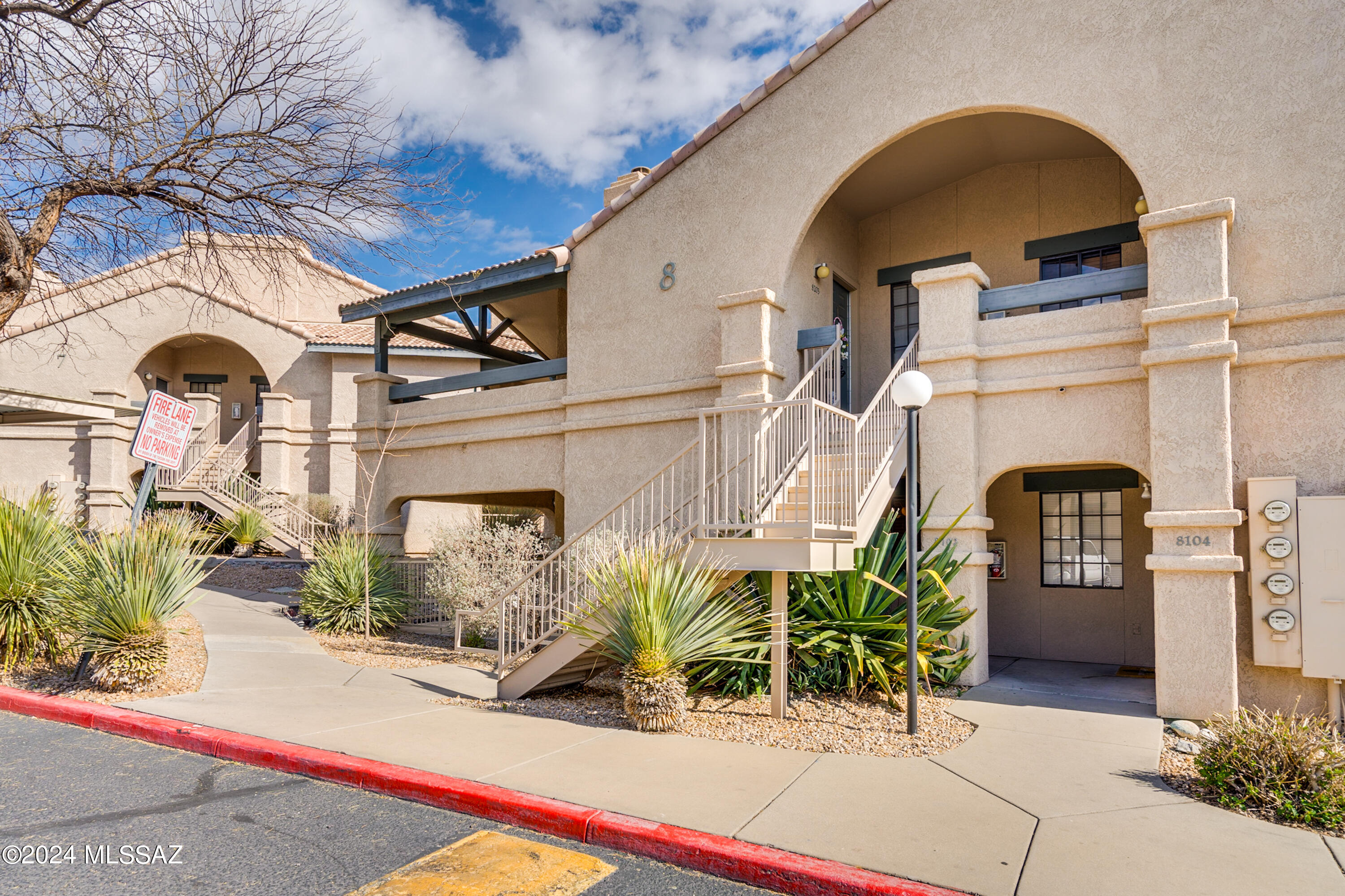 Ground level 2 bedroom / 2 bathroom condominium located in the desirable Starr Pass Community.  This home has been impeccably maintained. Homes interior was recently painted. Tile floors through out with no carpet. Cozy Wood Burning fireplace in the great room. Owner added additional cabinetry in the kitchen and bathrooms for storage. Refrigerator, Washer and Dryer are all included in the sale. The patio offers custom railing for additional privacy. Unit 8103 is conveniently located near the tennis court, pool and work out facilities.  HOA fees include water, trash, road maintenance, exterior care and blanket insurance policy. Starr Pass offers close proximity to schools, shopping, I-10, and allows for easy access to downtown Tucson and University of Arizona.