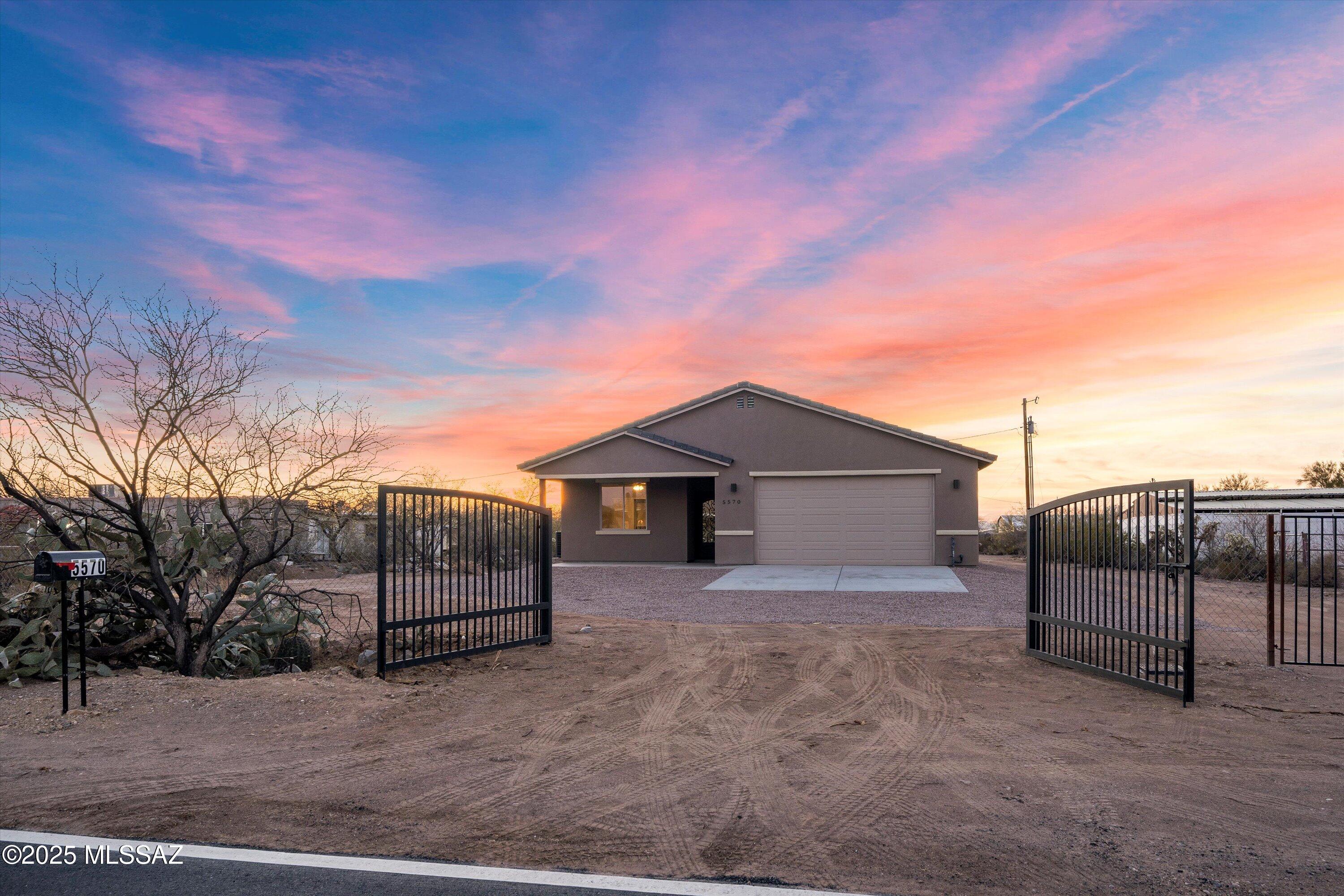 This NEW Construction home sits on over an acre of land facing east and west for the most desirable sunrises and sunsets! Interior boasts an abundance of space including 4 bedrooms and 2 baths. 9 ft ceilings and an open concept is an entertainers dream! Invite all your favorite people over for the 3rd of July and enjoy the award winning fireworks show from Tucson's exclusive Casino Del Sol! Newly paved road at the end of the street is ideal for privacy and minimal pass through traffic, Just seconds away from dirt for all your off road activities! The perfect blend of modern living and desert tranquility.This property offers easy access to  freeway, making commuting a breeze, and is conveniently located near a variety of dinning and shopping options. **Buyer backed out due to debt to income ratio too high**


Home is fully sheathed with 1/4 inch plywood all around. 
Equipped with fire sprinklers, and pre wired throughout exterior for security cameras. 4 ft retaining wall built underneath the entire home and wall sits. 2 feet above natural dirt level for flood hazard. 
Garage is pre plumbed for a water softner.