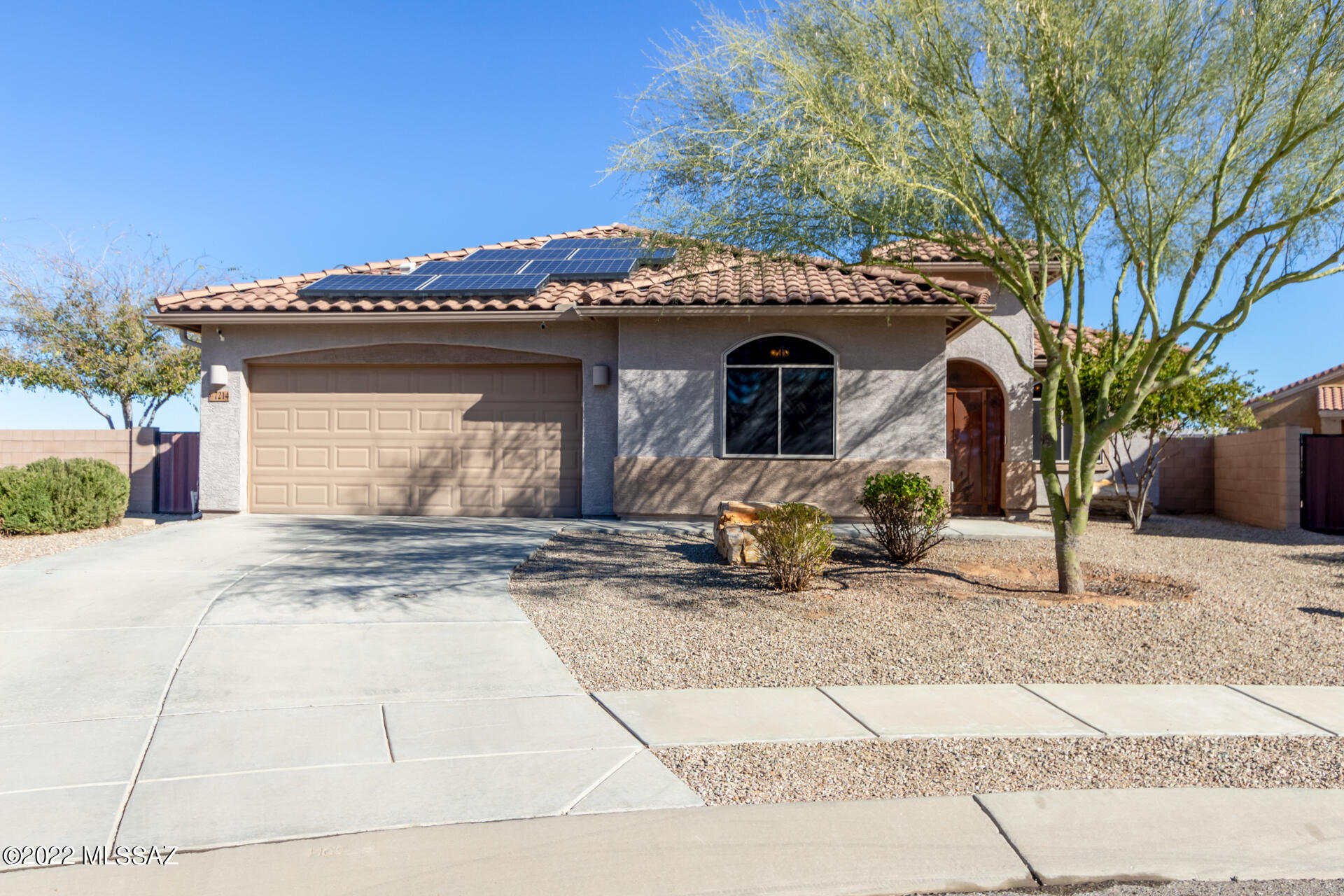 Wow! This energy-efficient 3 bed, 2 bath home w/ a den & attached 1 bed, 1 full-bath guest suite sits on a PREMIER lot & quaint cul-de-sac with fantastic views of mountains & sunsets! Inviting hallway leads to the immaculate open floor plan featuring tall ceilings, stylish tile flooring, soothing palette, & Arcadia doors to the back. Impeccable kitchen comes w/recessed lighting, SS appliances, granite counters, a pantry, plenty of upgraded wood cabinetry w/crown molding, & an island w/a breakfast bar. The romantic main retreat offers lovely wood-look flooring, an ensuite w/dual sinks, tile counters, a glass shower, & a sizable walk-in closet. Other bedrooms enjoy soft carpets. The guest's quarter has a living room, kitchenette, SS appliances, carpeted bedroom, private bath, laundry closet, & a separate entrance perfect home for a new family dynamics. You'll love hosting fun gatherings in the vast backyard with a covered patio, pavers, citrus trees, garden, a pond, a gazebo, & breathtaking mountain views! This home offers many extras...water softener system throughout the home, 2-year HVAC system, 2 custom Murphy beds, new security screen doors, cameras, sunscreens on windows, and remodeled bathrooms and faucets, and storage units, are just a few of the highlights. A Must See! Own the home meant for you!