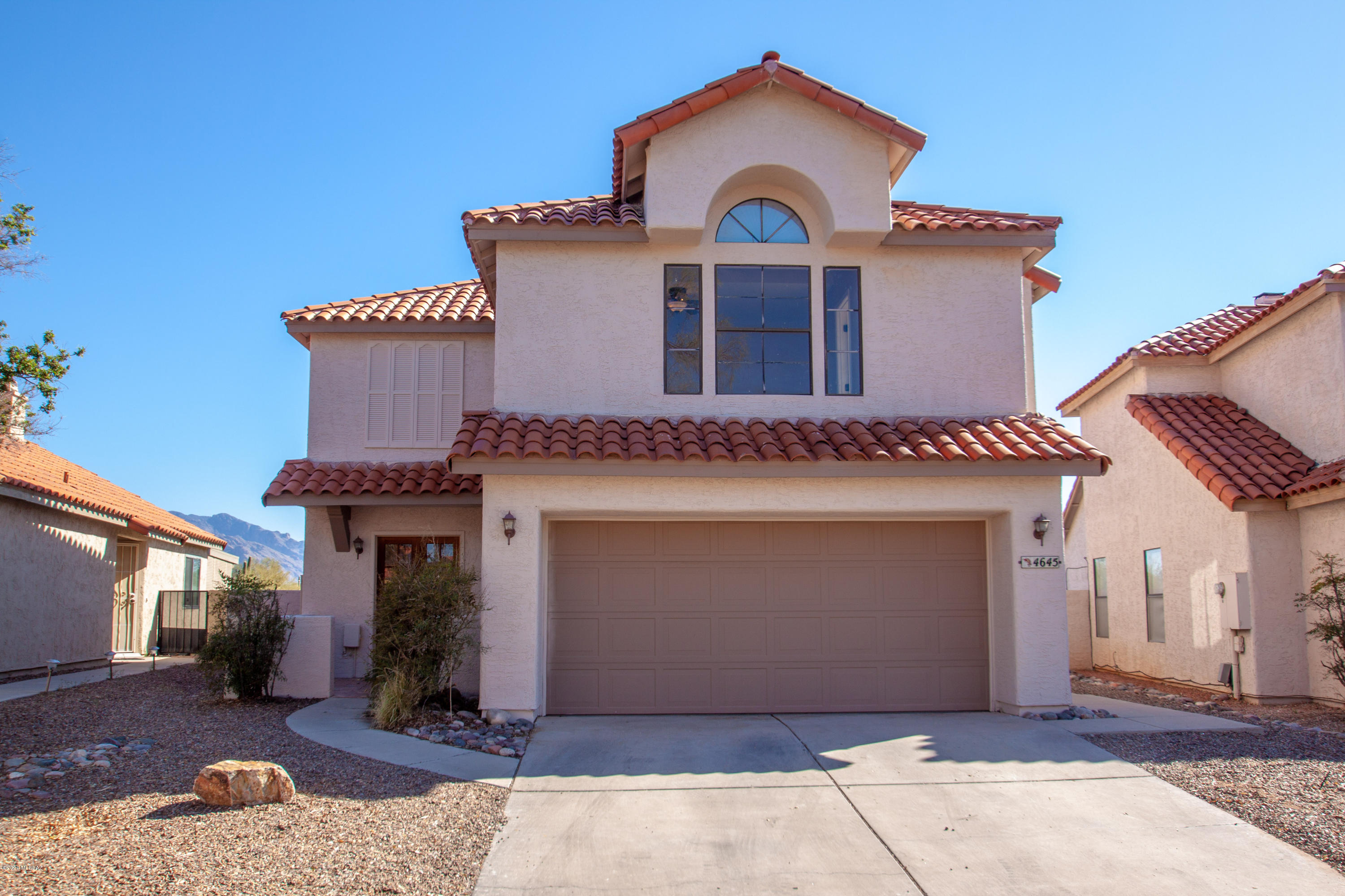 3 BR Home in Gated Community of Countryside Valley located on a HUGE lot, backing up to open desert with Spectacular Views of the Mountains! Great Room w/ tiled floors. Granite Countertop & Breakfast Bar, All Appliances, Patio off Kitchen thru Double French Doors, ideal for meals or patio furniture; Rear Covered Porch looking towards the Catalina Mountains; Powder Room; Fireplace and Vaulted Ceilings in Great Room w/ Mountain Views; Dramatic Stairway to 3 BRs upstairs; BR #2 w/ Mt Views; Spacious Master BR w/ large Walk-in Closet, Tiled surrounds in Tub/Shower, Double Lavs, & Window seat; Tiled surrounds in Hall Bathrm as well; Ceiling fans throughout; Numerous Amenities in Countryside w/ Lap Pool, Kids Pool, Spa, Basketball, Racquetball, Tennis, Playground and MUCH MORE! See Info sheet .