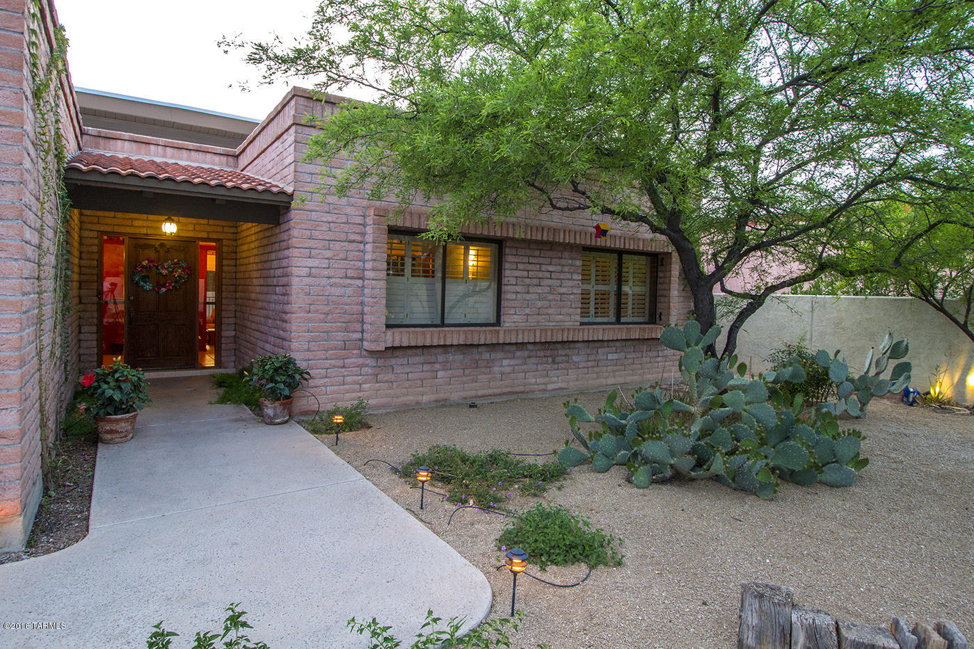OLD FORT LOWELL, ONE OF TUCSON'S MOST TREASURED “HISTORY STEEPED LOCATIONS”.  Mid-town but feels miles away. Find walking paths, historic monuments, Artists and Executives. Privacy and seclusion with this home set back and tucked away from the street. Large lot with great outdoor space and a terrific pebble tech pool surrounded by brick patios and mature mesquite trees. Great indoor out door connection for when you finish lounging by the pool,  behind door number one cozy family room perfect for hanging out and drying off before you enter the large living room with high ceiling, huge windows and terrific natural light. And just for you behind door number two, a great size master bedroom and bath with ample closet space. This home has space that is great for family, friends & bit of pri