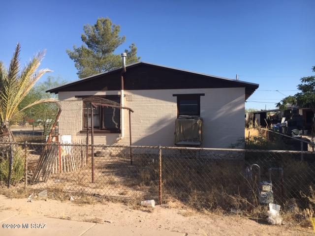 Original 1956 home  - great properlty to flip or just be a first time buyer home. 3 storage buildings in rear yard - concrete driveway for off street parking