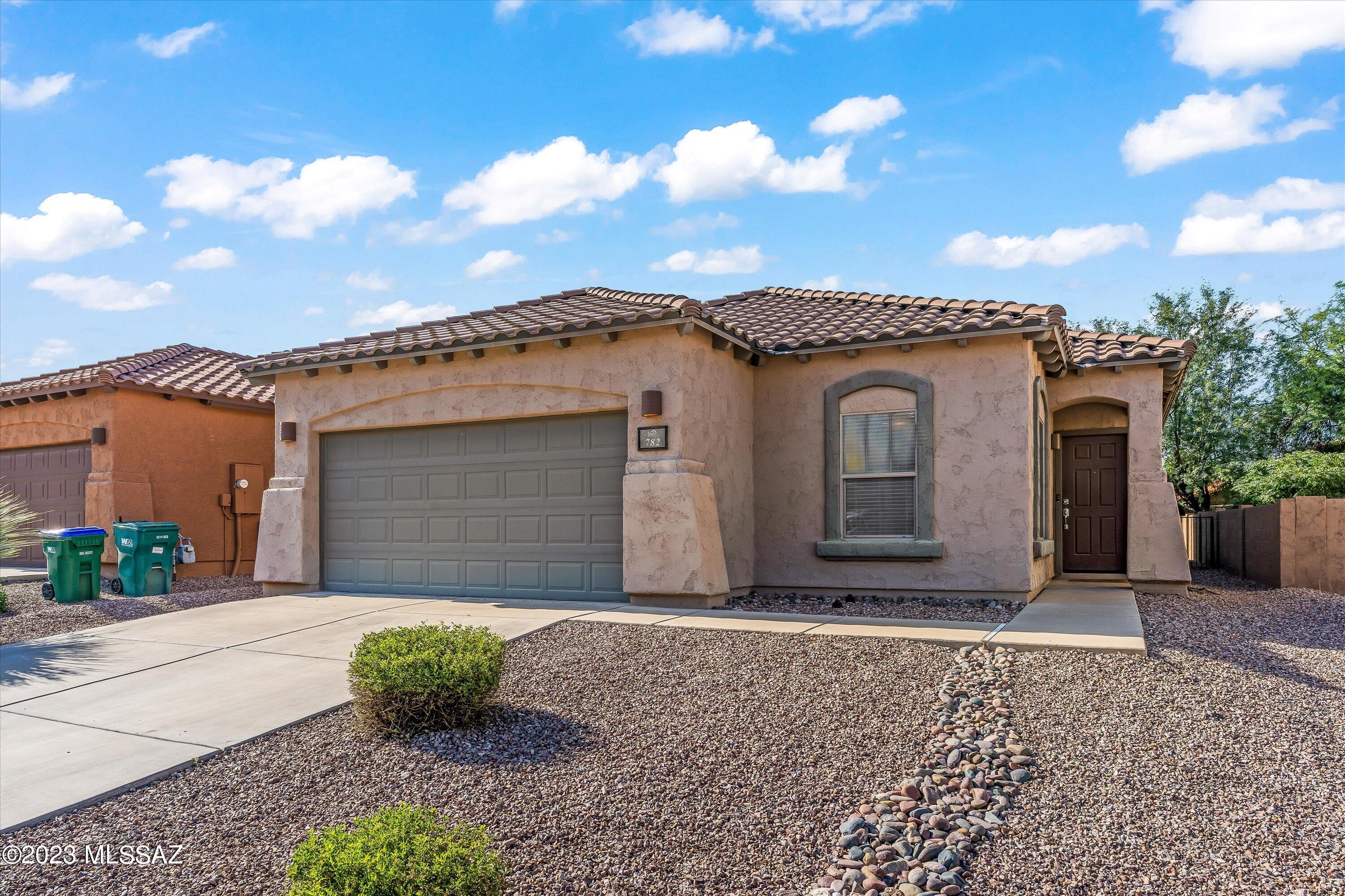 Your beautiful new home awaits... a charming home nestled in the heart of Award-Winning Rancho Sahuarita.  This immaculate home features 3 large bedrooms & 2 bathrooms, offering ample space for comfortable living. The open concept floor plan is perfect for everyday living and entertaining. This home is turn-key ready with all appliances included and a beautifully landscaped back yard. All is ready for you to move in and enjoy! Additional home features include a spacious kitchen with lots of counter space, upgraded cabinets with pull-outs, tile floors, and a center island. The huge Primary Suite features a huge walk-in closet and ensuite w/dual sink vanities. All in the desirable Rancho Sahuarita community with easy access to all of its amenities, restaurants, and shopping!