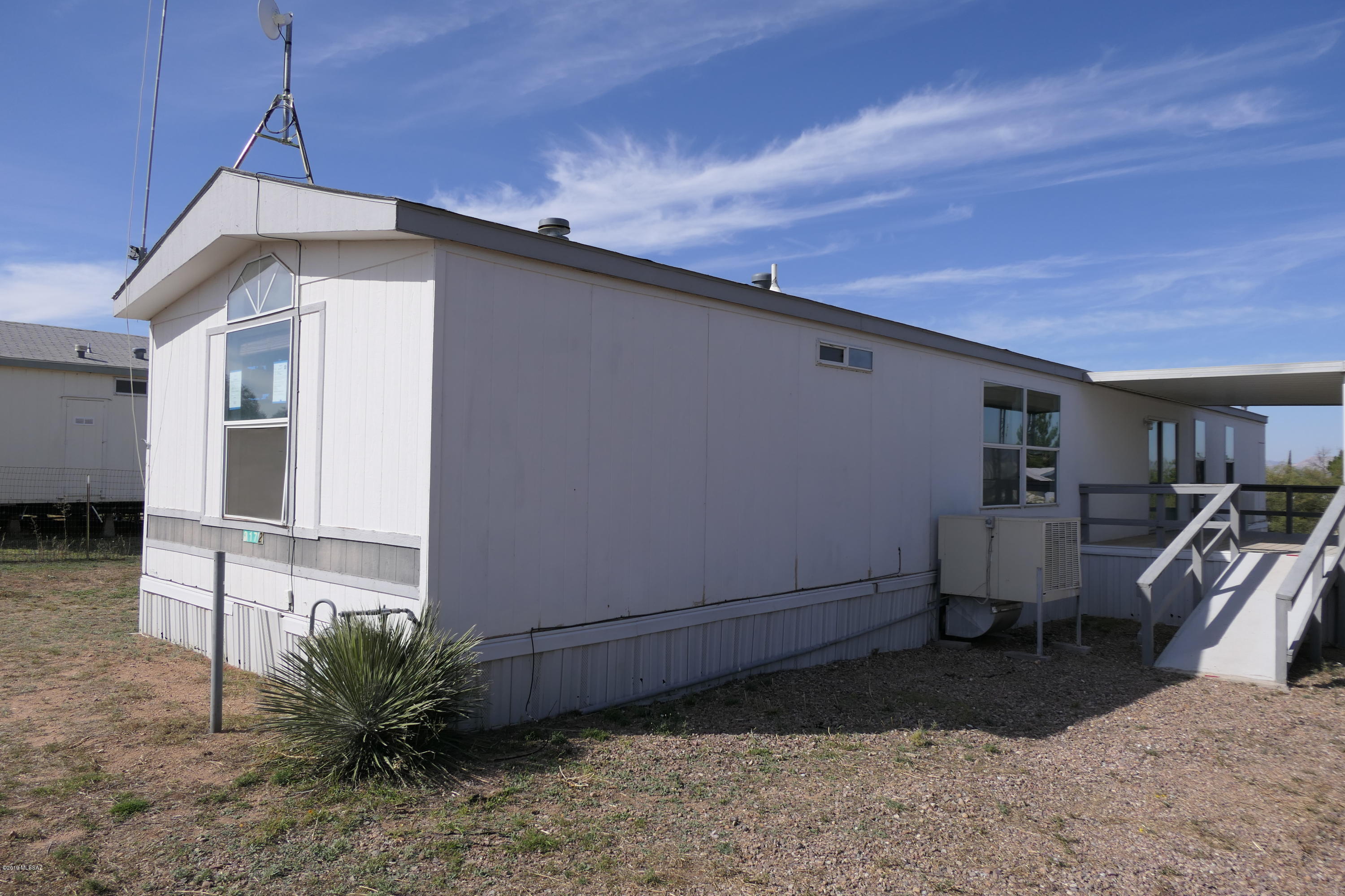 PRICE REDUCED Great manufactured home in nice neighborhood with an ample deck to take in the mountain views. Close to Benson and Tucson. Easy access to freeway. You can see the pride of ownership in the area. This one will make you smile. 2 bedrooms, 2 baths with very large living room.Manufactured home, HUD Home. Sold ''AS IS'' by elec. bid only. Prop avail 3/10/20. Bids due by 11:59 PM
Central Time daily until sold. FHACase #022-268769. Insured. Eligible for FHA203K. For Prop conditions, Forms, Discl& Avail please visit www.HUDHomestore.com Property is NOT located in a FEMA Special Flood Hazard Area but is listed as a moderate to low flood risk. Please refer to www.floodtools.com for
additional information regarding flood zones and insurance, Uses a septic system. A
