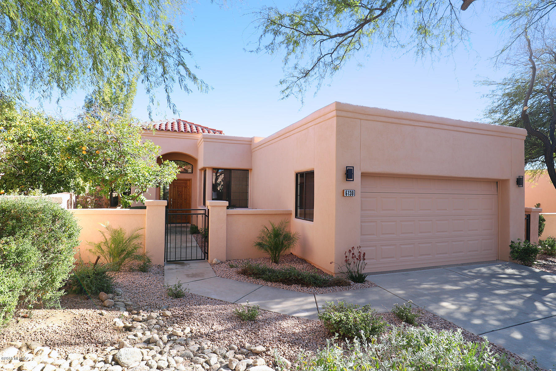 STUNNING RENOVATED HOME IN GORGEOUS ''PALOMA DEL SOL''. FIND YOUR TRANQUILITY ON THIS PRIVATE LOT WITH GORGEOUS MOUNTAIN VIEWS. RE-DESIGNED FLOORPLAN HAS BEEN MODERNIZED FOR TODAY'S LESS FORMAL LIFESTYLE. MODERN, LUXURIOUS KITCHEN WITH CUSTOM, SOFT CLOSE CABINETS, DRAMATIC ''WHITE ICE'' GRANITE, BLACK SLATE APPLIANCE PACKAGE AND JAZZY GLASS BRICK BACKSPLASH. SLEEK BATHROOMS WITH MODERN FINISHES. SPACIOUS BEDROOMS OFFER DESIGN FLEXIBILITY. CHARMING BACK PATIO BACKS TO A LUSH ARROYO AND HAS GREAT MOUNTAIN AND VALLEY VIEWS. LARGE 2 CAR GARAGE WITH EPOXY FLOOR AND BUILT-IN CABINETS. NEW  A/C AND FURNACE AND 2-YEAR ROOF WARRANTY. SURROUNDED BY 27 HOLES OF PRIVATE, NICKLAUS DESIGNED LA PALOMA COUNTRY CLUB. RECENTLY RENOVATED COMMUNITY POOL AND SPA. AGENT/OWNER.