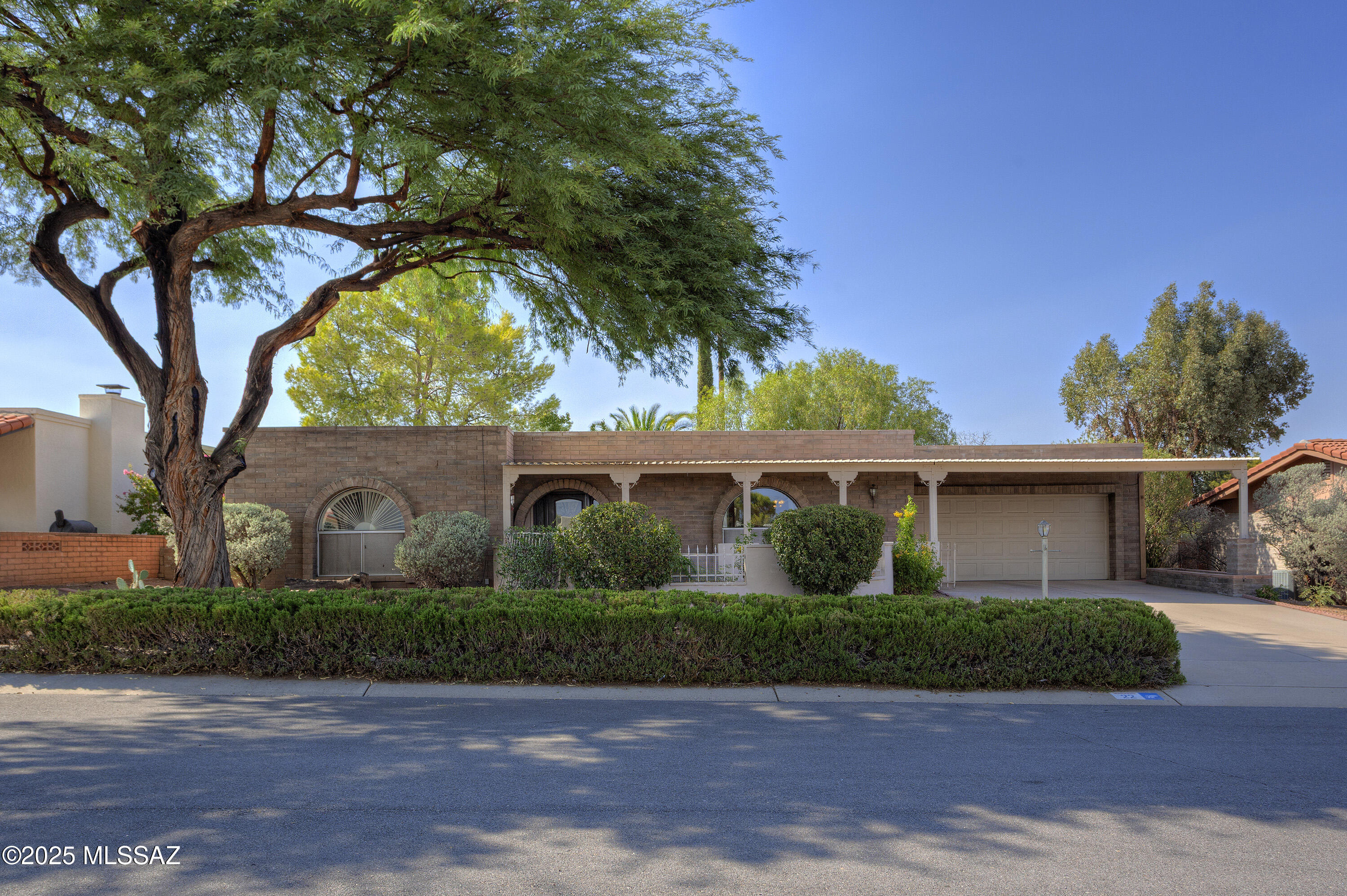 Discover the perfect blend of comfort and Southwest charm in this beautifully remodeled 2-bed, 2-bath home. Savor morning coffee with mountain views from the front courtyard, or retreat to the screened patio overlooking a private backyard oasis full of mature landscaping. An updated kitchen, refreshed baths, and a new walk-in shower in the primary suite make everyday living a delight. Stylish vinyl flooring, new appliances, and a 2-car garage with a small workshop add ease and function. Recent upgrades include a water heater, thermostat, and AC compressor. Leased solar helps keep energy costs low— leaving you more to spend on what you love.