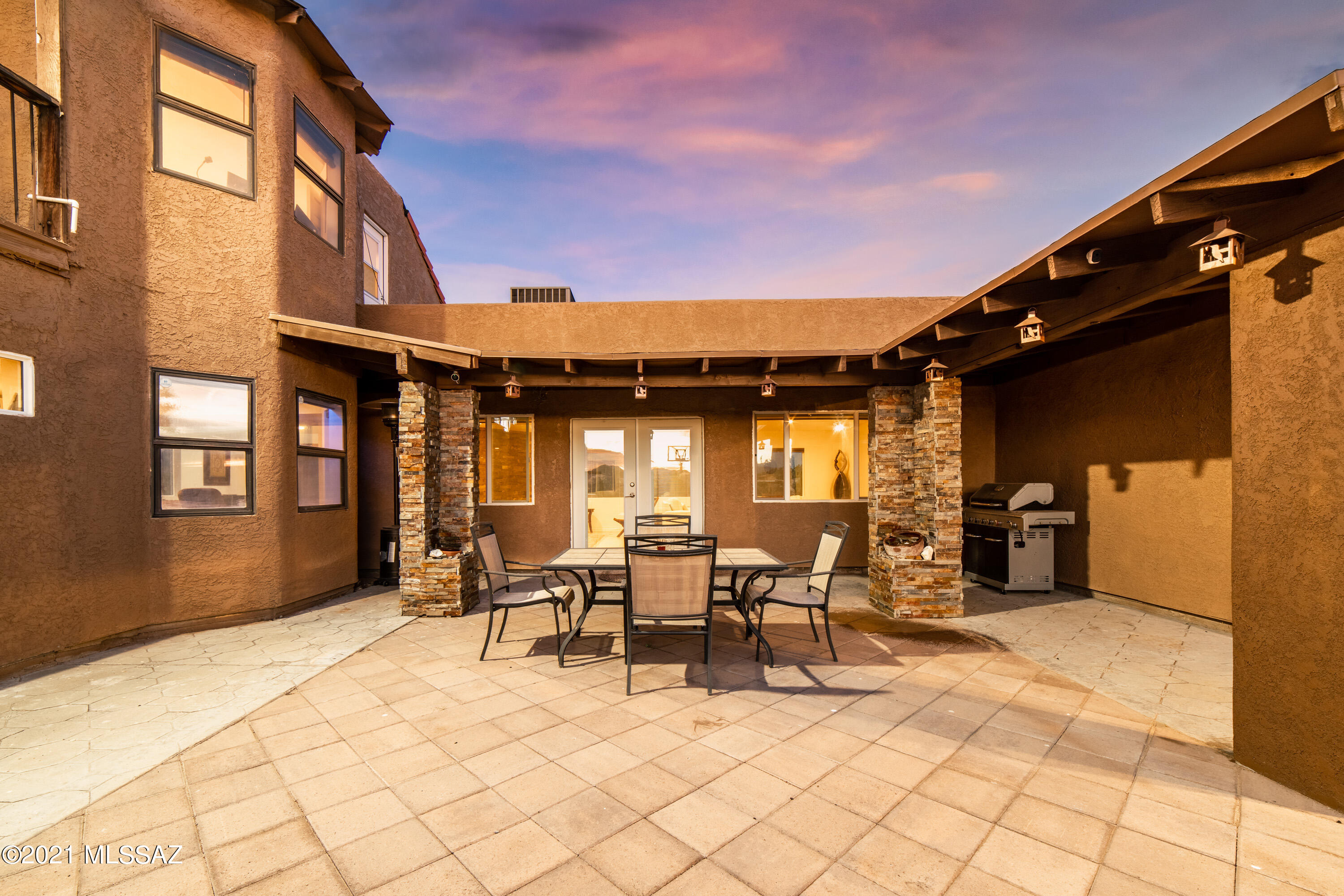 Rare opportunity to own a private hill in Tucson with no neighbers around you. Unique, private gated huge single family (3bed/2bath)  property with two guest suites (1bed/1bath and 2bed/1bath, both with kitchenette and laundry hookups) and a hallway. Perfect for multi generation living or live in one and rent/Airbnb the other two units for a cash flow or use a part of it as your office or workshop or just remove the drywall (blocked door way) and replace the door back and enjoy the whole property as a huge single family property with a few master siuts as it was designed originaly. Located on the top of a private hill with panoramic views of city lights, mountain, sunset, sunrise & desert. The main property, guest suite #1 , pool and hallway are completely renovated and in new condition. Fully remodeled kitchen and kitchenette with top of the line granites and cabinets, renovated bathrooms, flooring, fresh paint, new doors and french doors,.... More than 600 sf permitted addition with a wet bar. Private master bedroom at upstairs with a large size porch. Fresh air with 2 brand new AC and 2 new mini splits. Pool has been recently resurfaced and comes with new equipment. The guest suite# 2 (currently occupied) is in original shape and needs some TLC. Several mature fruit trees. The property is equipted with inside and outsite security camera and smart home features. Also the Landscaping has been started (concrete driveway and side yard slabs and artificial grass) not completed due to the owners sudden move to out of state. Sold as is, Lot of potential, No HOA . Owner agent