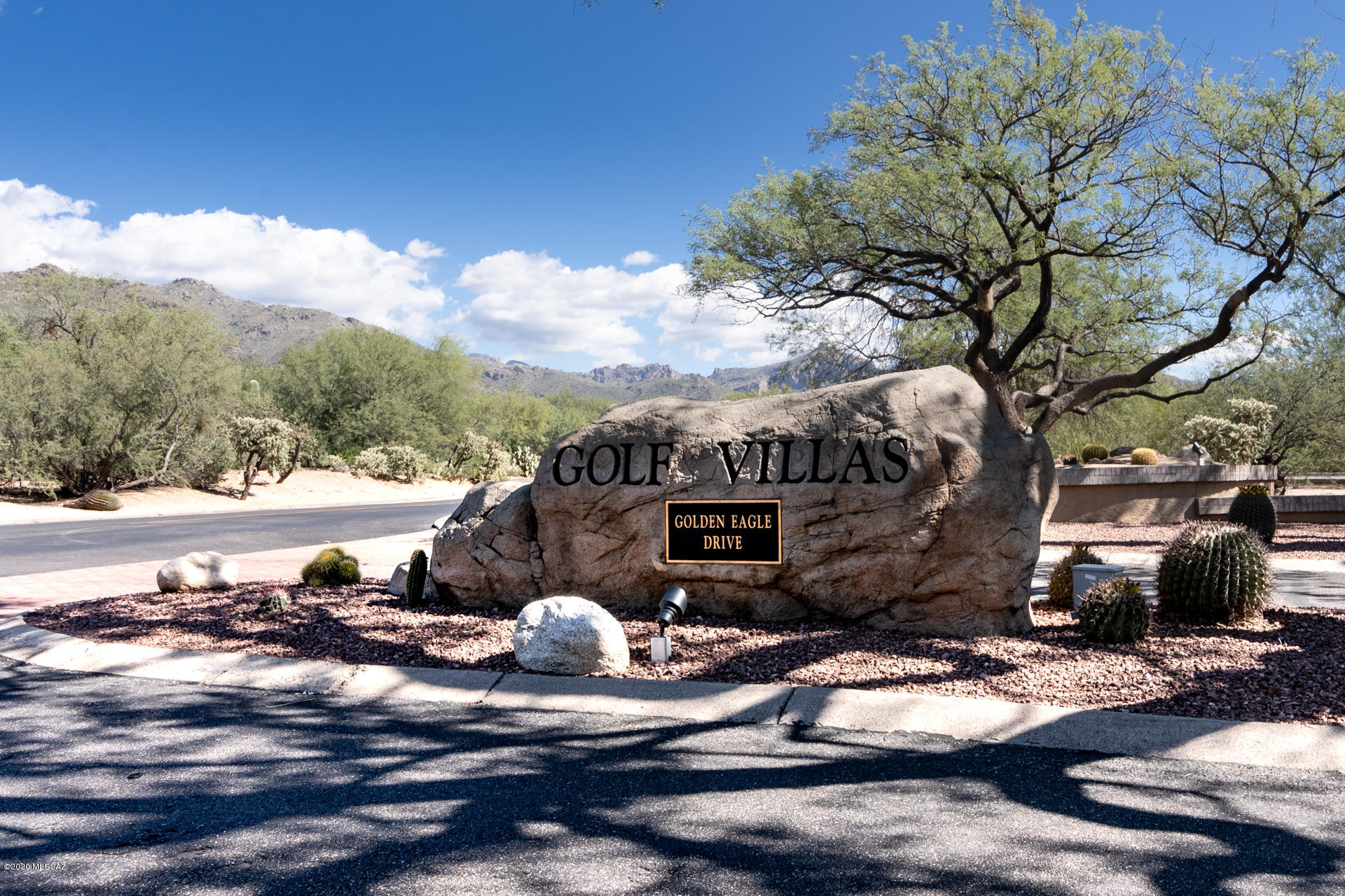Charming Ventana Golf Villa on quiet cul-de-sac lot w/beautiful mountain view. Private gated community w/24 hour manned gate at base of Catalina mountains. 2 bedroom 2 bath w/ Den for home office or extra guests. 15' vaulted ceilings over great room showcasing fireplace, wet bar & mountain view. Light filled kitchen w/granite counters, stainless appliances & bkfst nook. Split plan w/master bedroom access to private patio for entertaining/relaxing during our perfect Tucson winters.Cheerful guest room & bath w/ extra privacy for visitors. Travertine floors give authentic southwest feel & enhance the low maintenance lifestyle of this Villa. Heated community pool and spa nearby, HOA handles landscaping of front yard & common areas. New roof,HVAC & tank less water heater 12/2015.