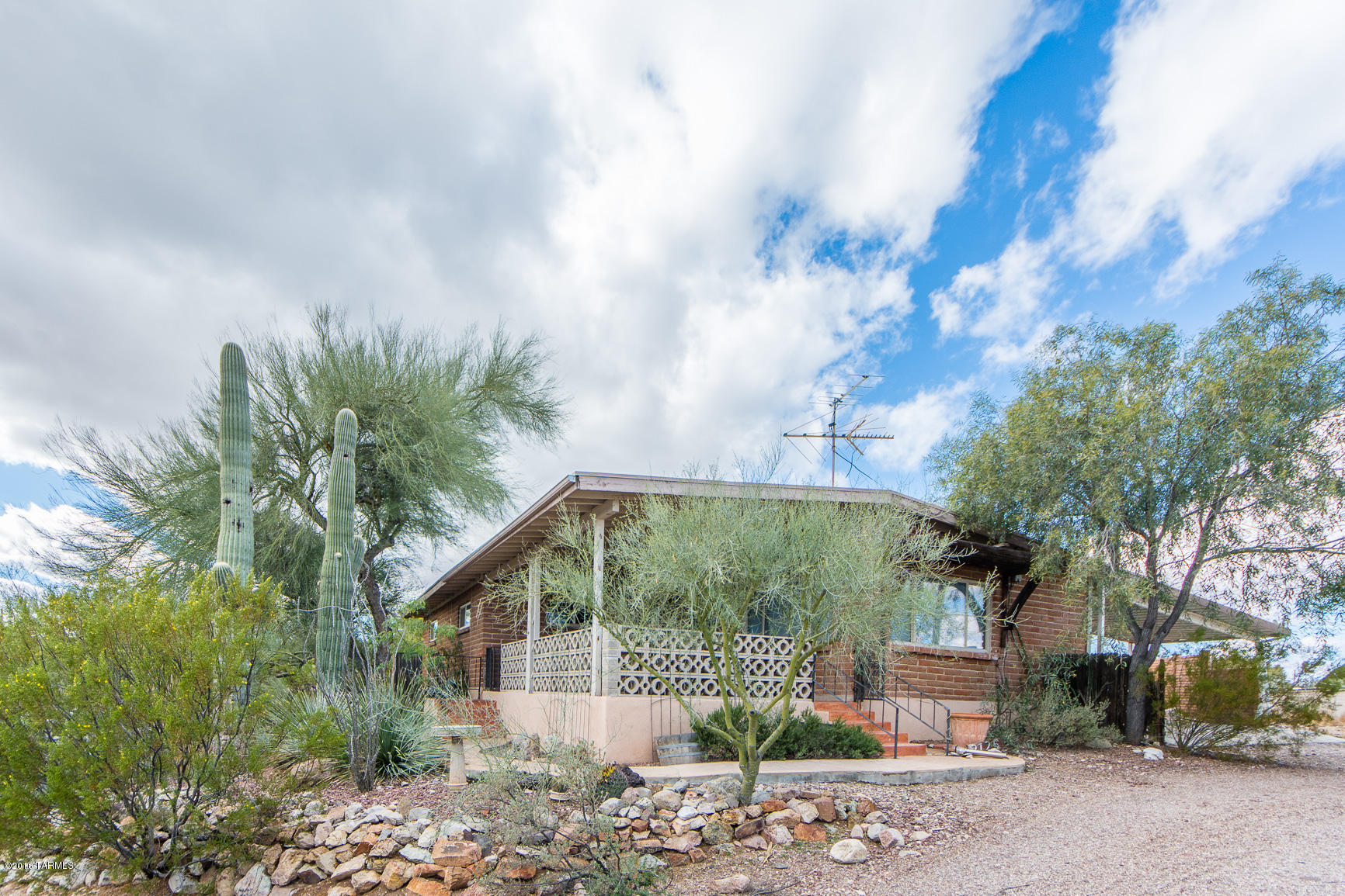 This unique Ironwood Hills home sits on a high .25 acre lot. Energy efficient windows and a brand new 5 ton air conditioner.New wood laminate in the main house bedrooms and an open kitchen concept with new heat resistant granite counter tops are the start of the updates. City and mountain views from your living room and front porch make this classic Tucson home a great living experience. Your 900 square foot guest house is a one bedroom and one bath with a study and full kitchen also with granite counters! Two separate yards allow for each house to have its own yard or a dog run. THIS IS AN APPROVED SHORT SALE AT 190K. That is the only offer accepted. Bank will pay 3% closing costs! No repairs will be made. AS IS. Contact your agent or listing agent ASAP