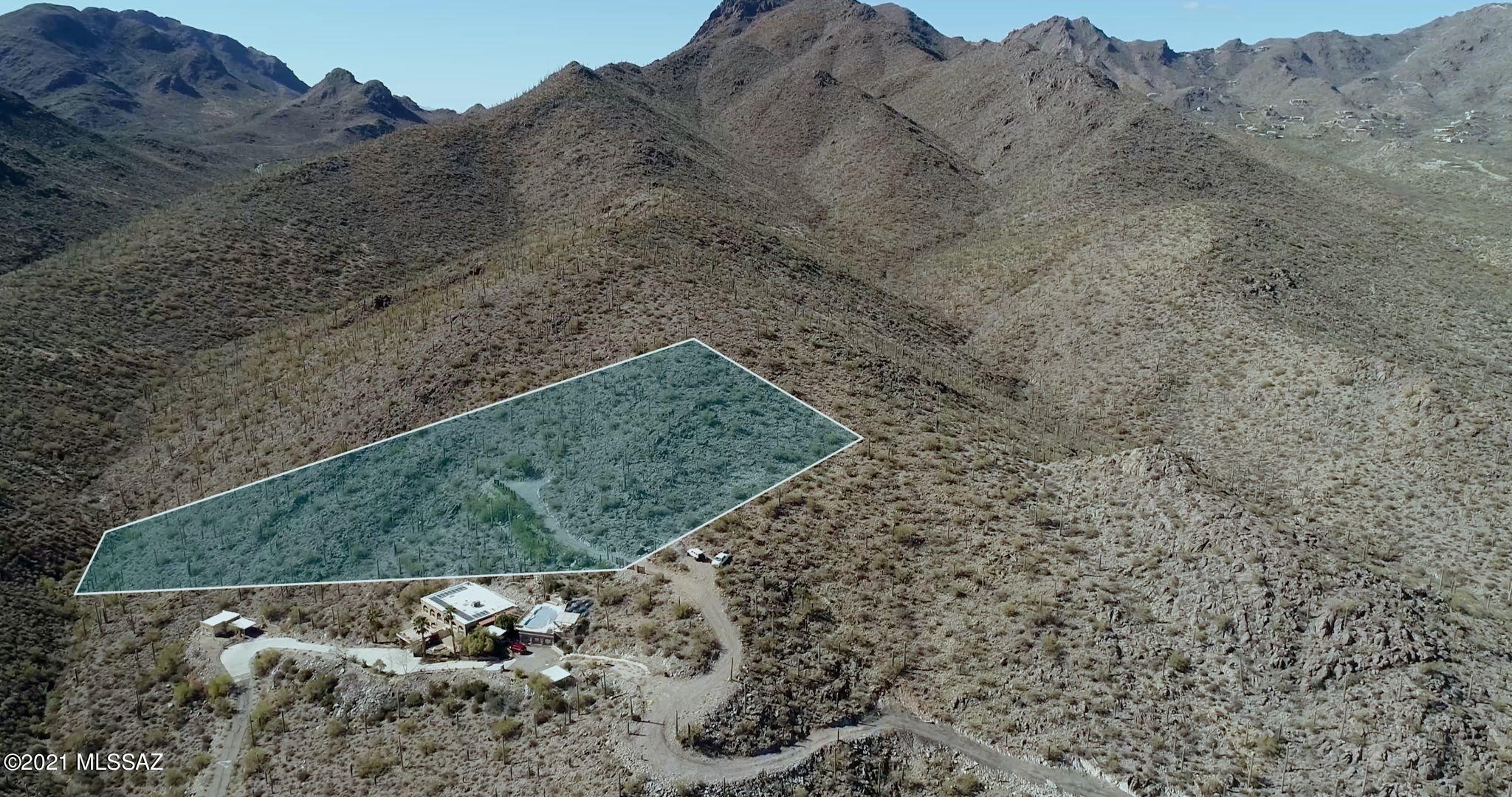 The highest lot in the subdivision sitting at a 2,946' elevation.  Adjacent to Tucson Mountain Park; Approximately 20,000 acres of pristine desert and trails. Thousands of saguaro studded acres right in your back yard! The 1.9 acre lot is improved already with a 400 amp Electric panel, has sewer connection and water to the lot line. Sunset Custom Homes has plans and floorplans with many upgrades and options available ready to accommodate your dream custom home on top of the hill. Owner is a licensed Real Estate Agent.