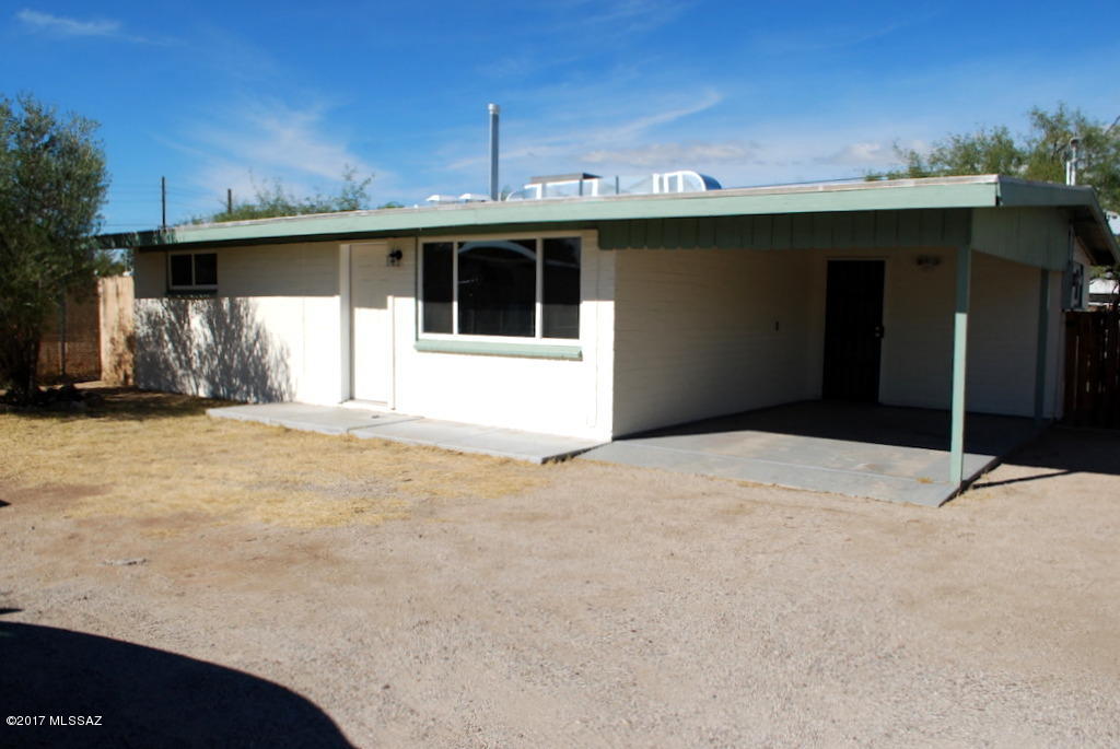 Updated Single Family home near Davis Monthan Air Force Base. 2 Bedroom 1 Bath and 1047 square foot. Large living area with vaulted ceilings. All tile floors throughout. New Central A/C and heat and dual pane windows. Updated kitchen with new cabinets, counters and appliances. Full size washer/dryer. Covered parking and lots of off street parking. Private off street entrance and gated entry. Large fenced yard that wraps around home. Tenants will have access to storage shed. Pets subject to approval.